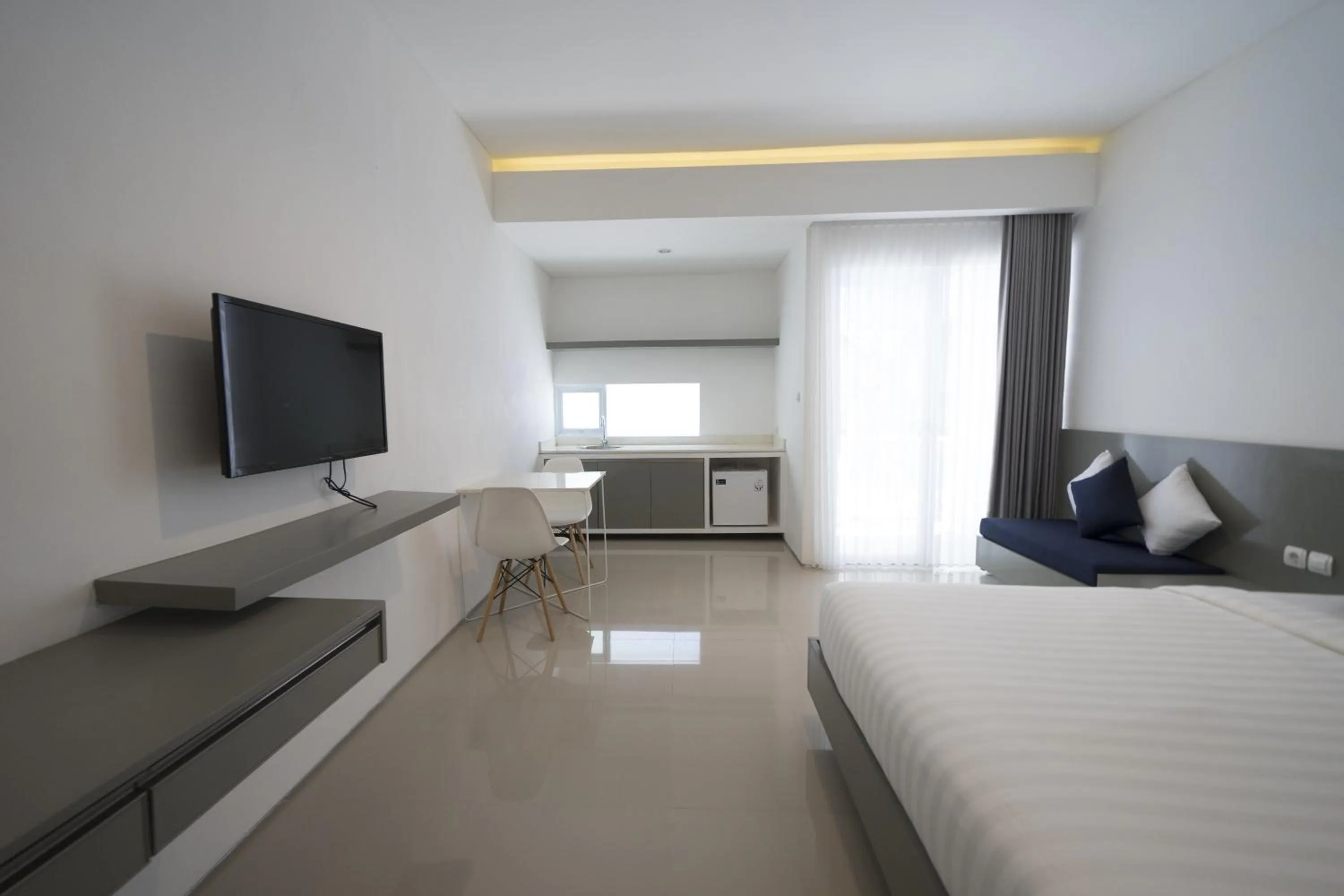 TV and multimedia, Bed in The Rooms Apartment Bali by ARM Hospitality