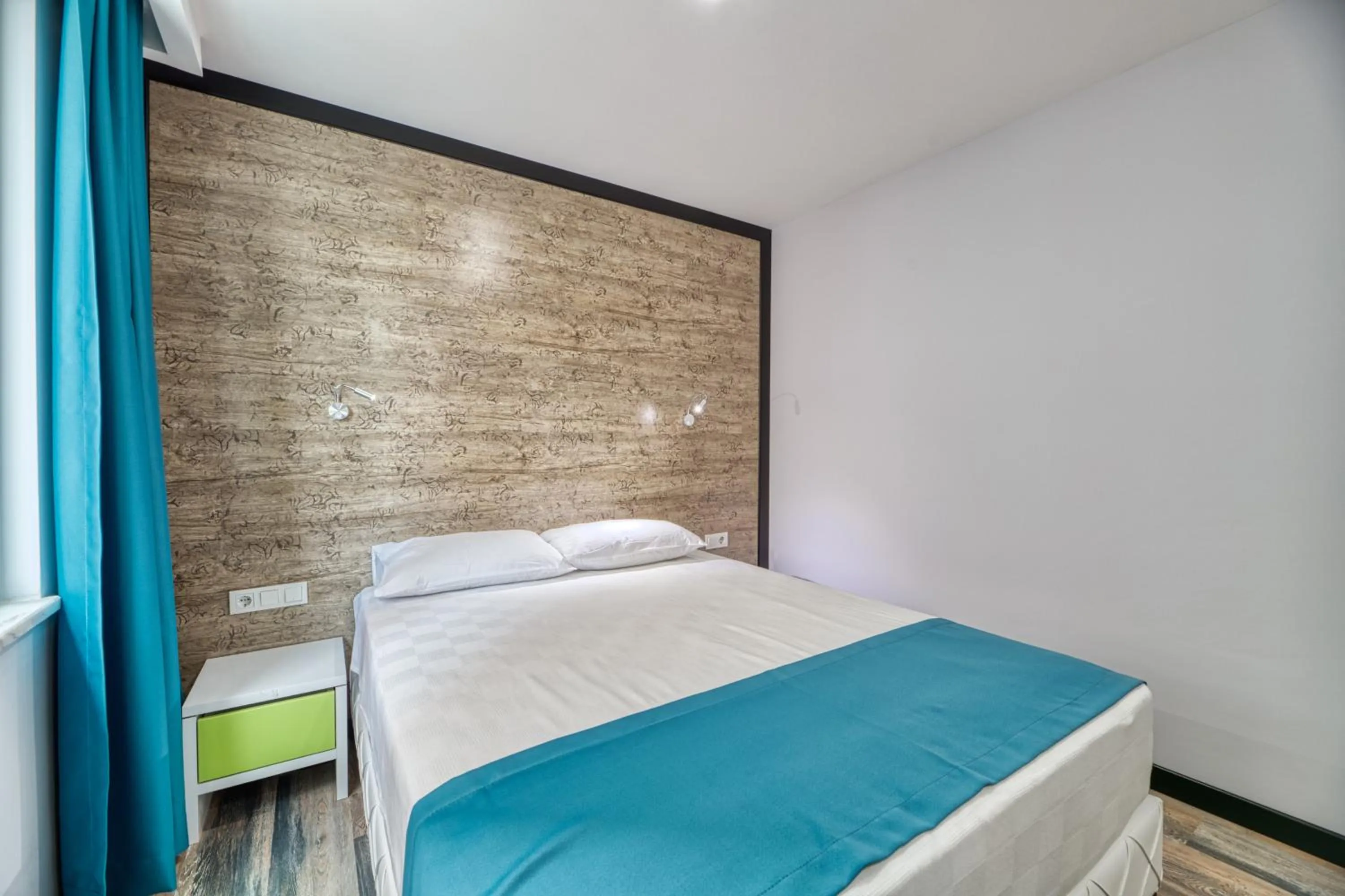 Bed in Grisverde Suites