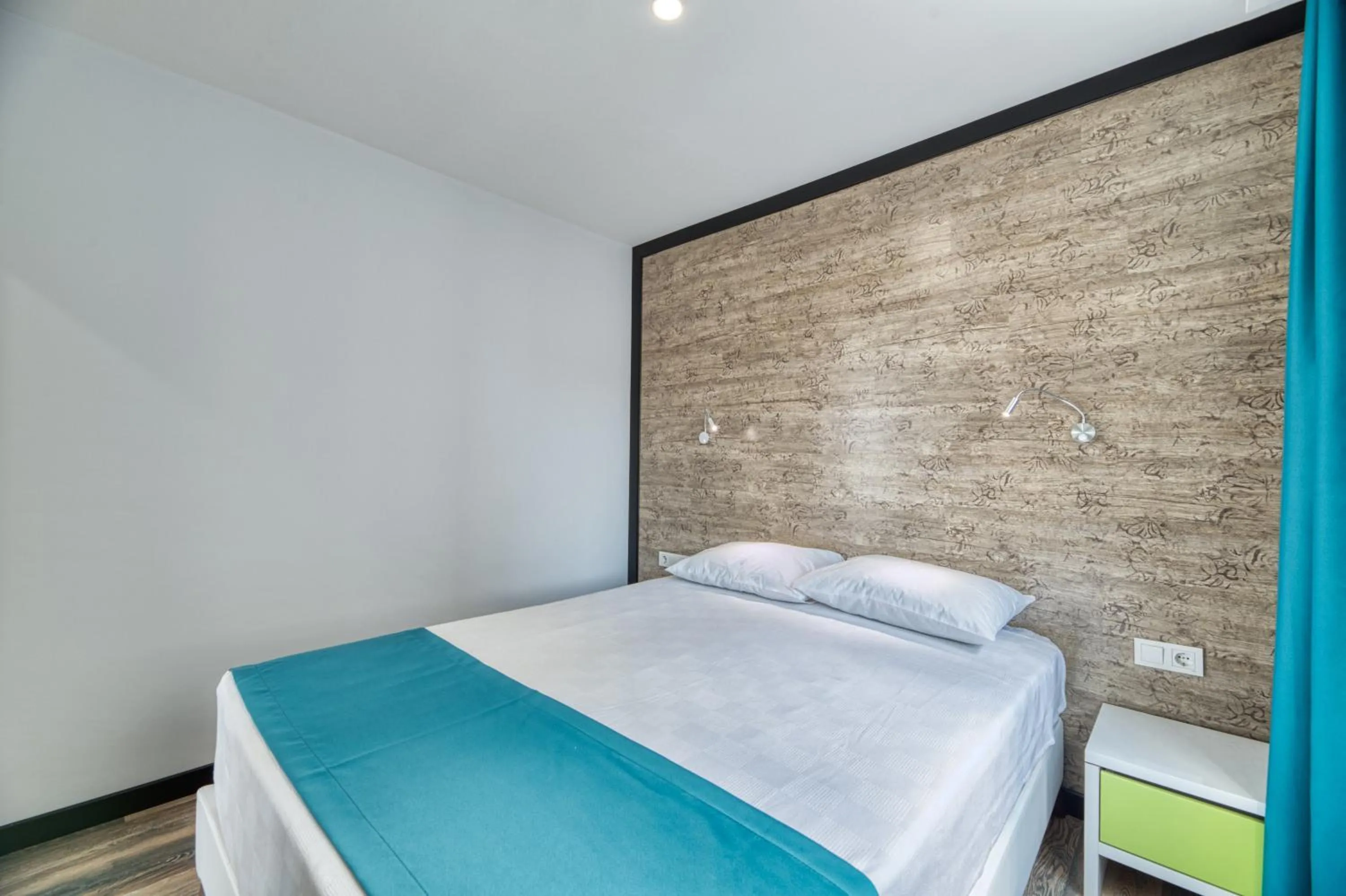 Bed in Grisverde Suites