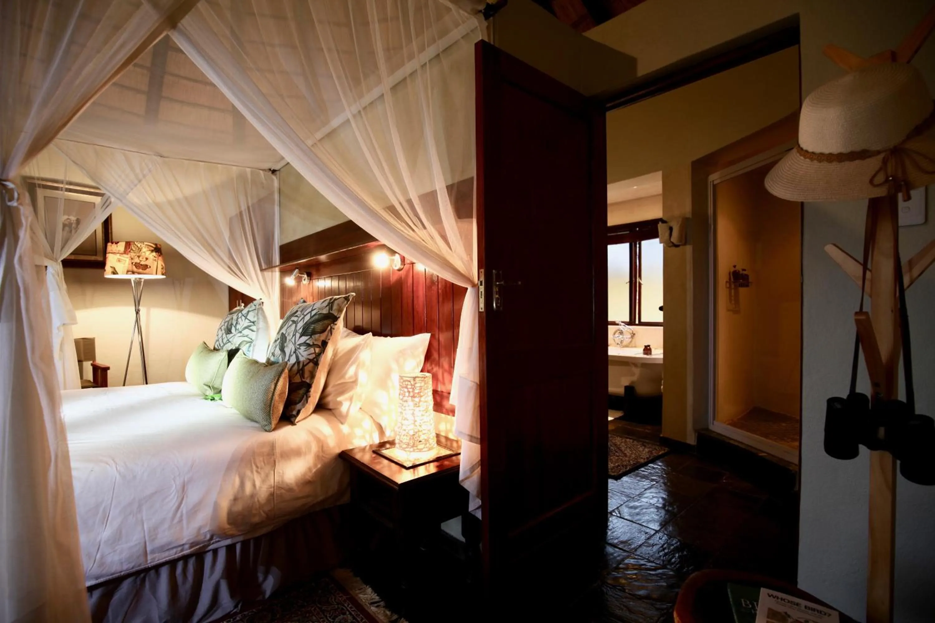 Bed in Ivory Wilderness River Rock Lodge