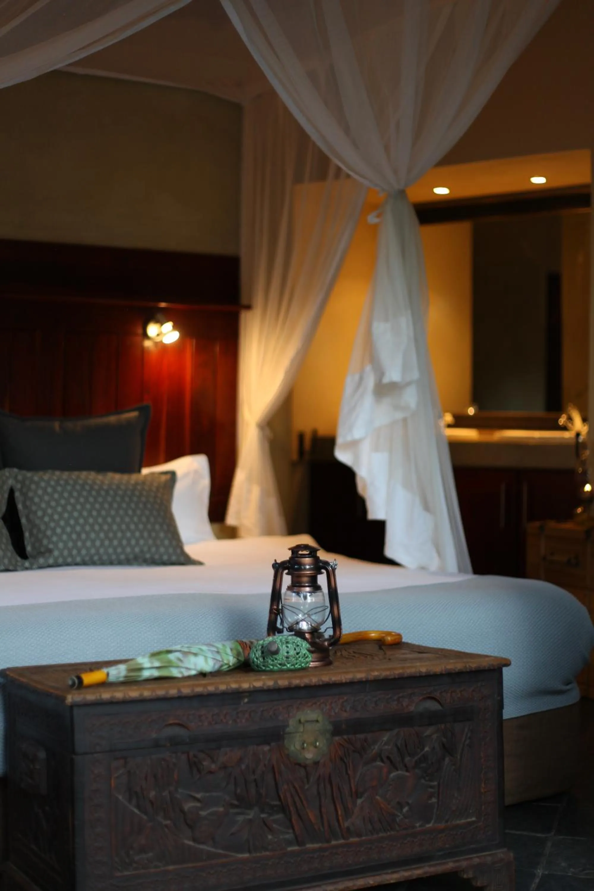 Bed in Ivory Wilderness River Rock Lodge