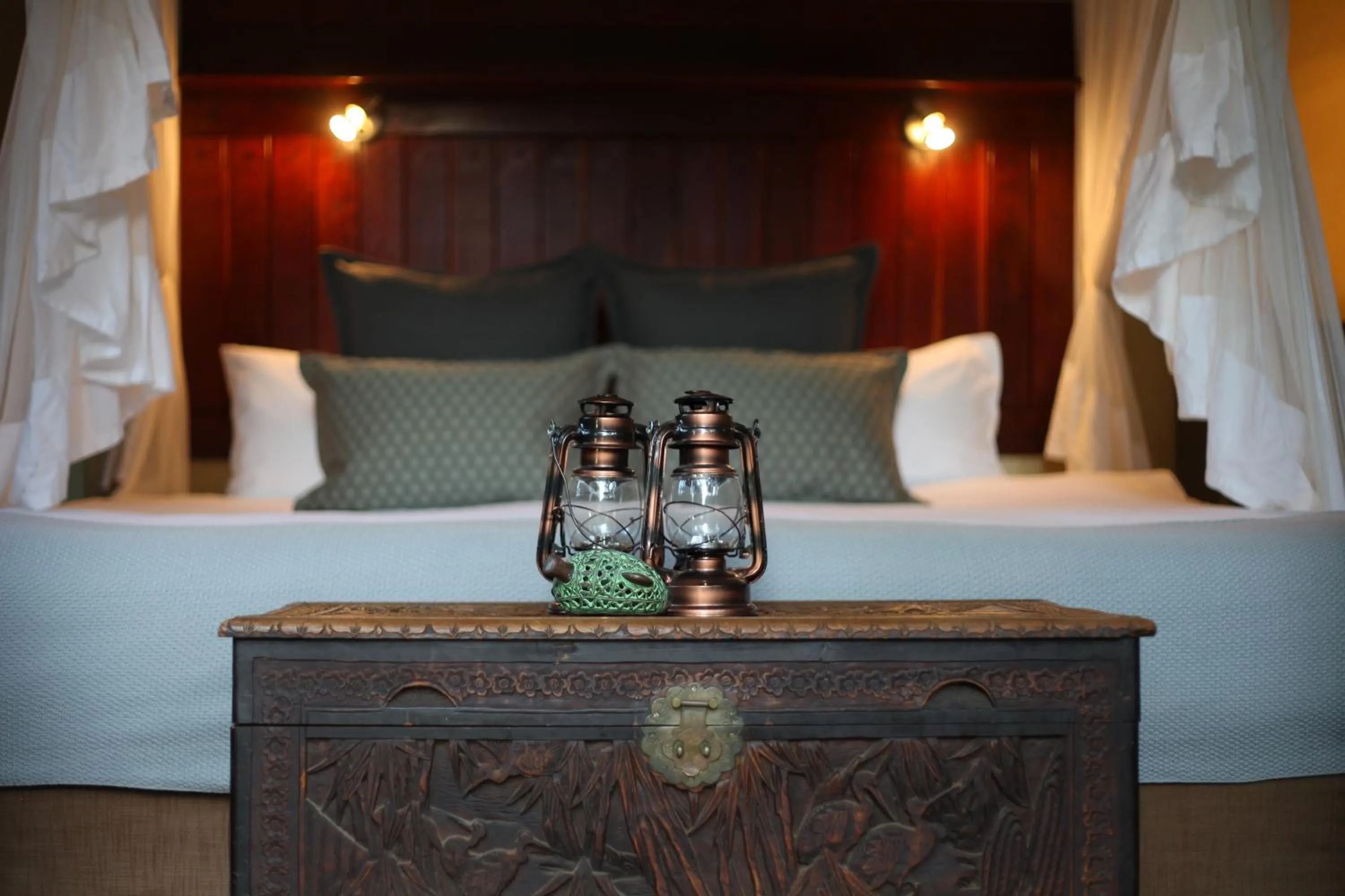 Bed in Ivory Wilderness River Rock Lodge