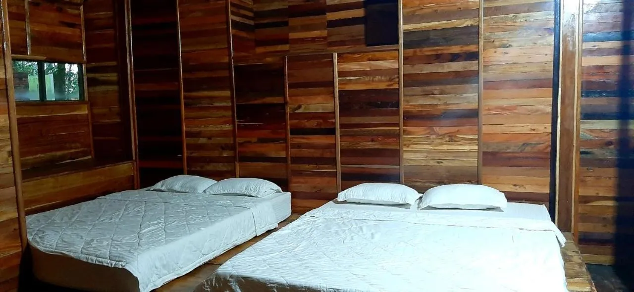 Bed in Green Bamboo Lodge Resort
