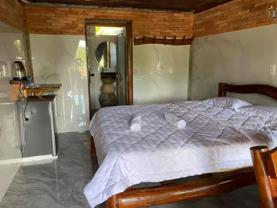 Bed in Green Bamboo Lodge Resort