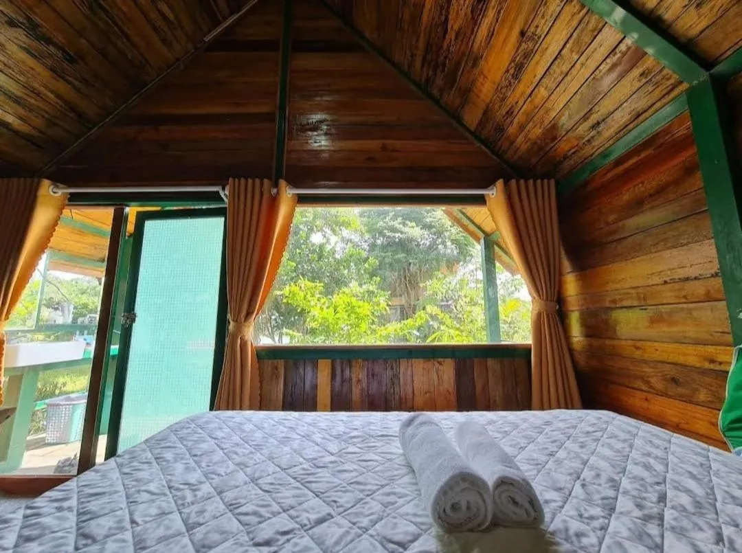 Bed in Green Bamboo Lodge Resort