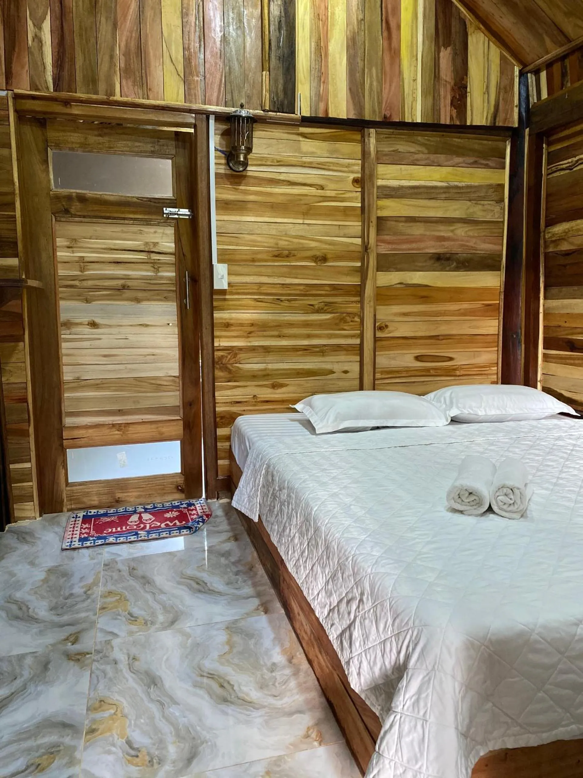 Bed in Green Bamboo Lodge Resort