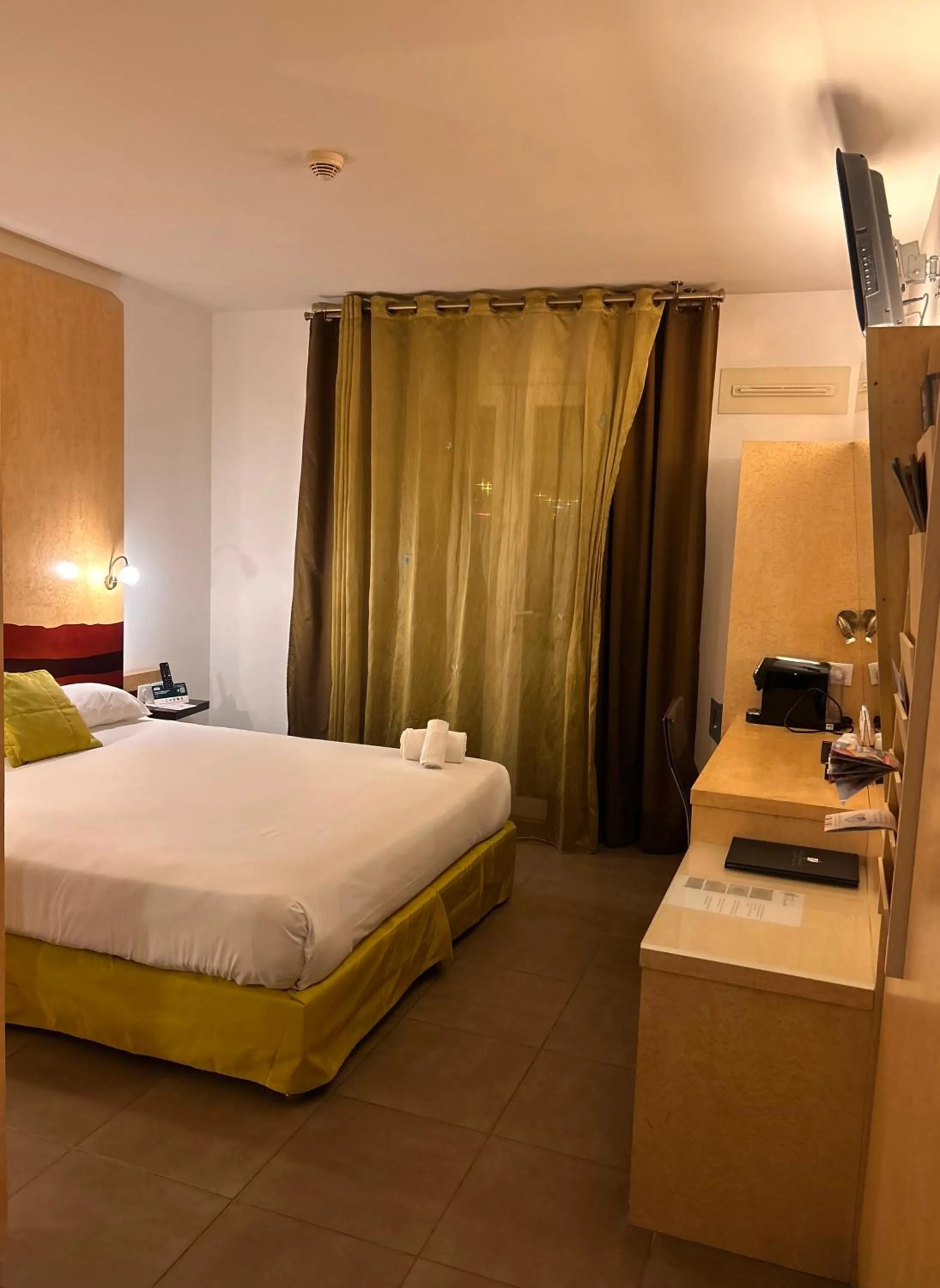 Bed in Logis Hôtel La Fauceille