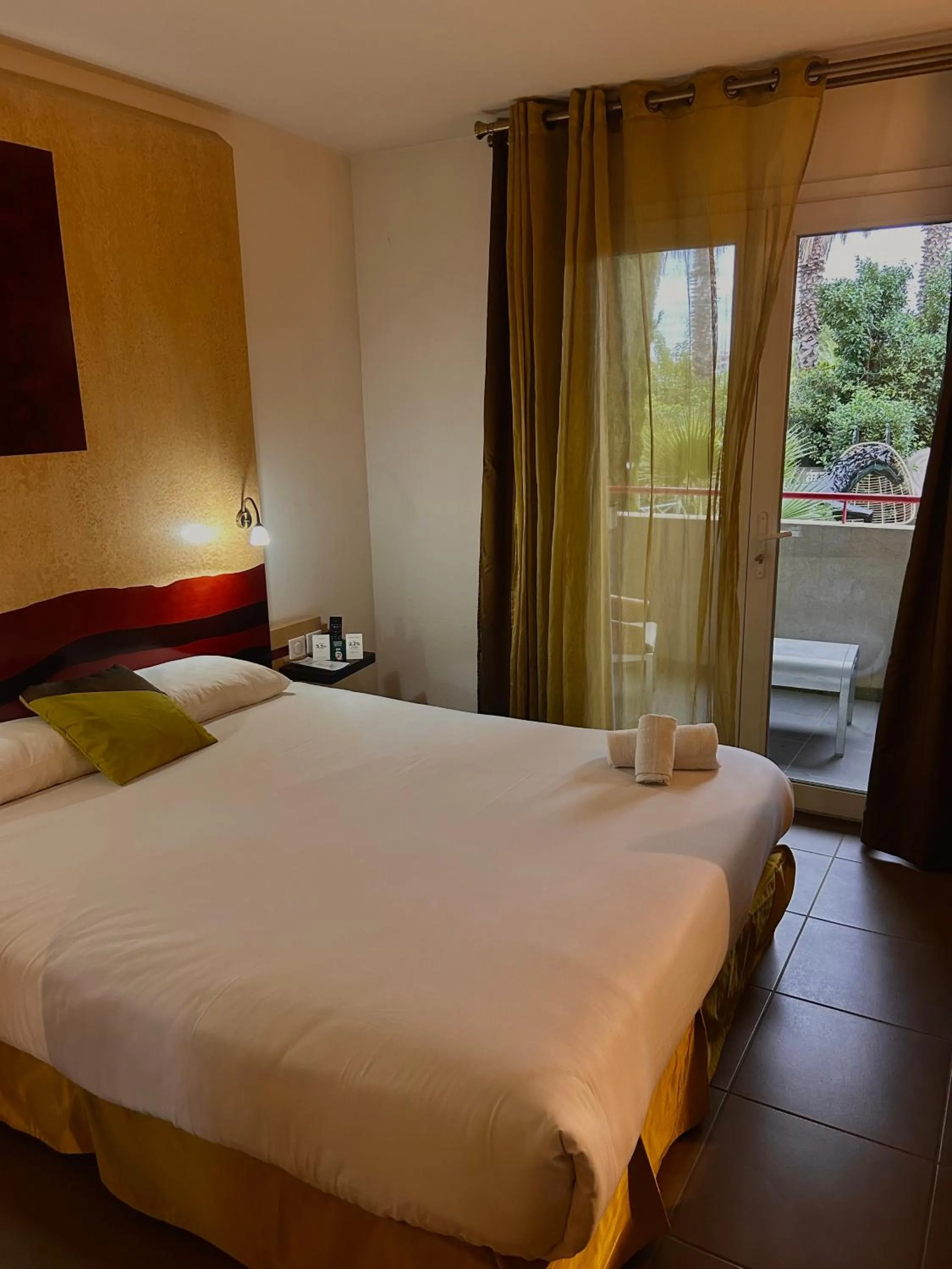 Garden view, Bed in Logis Hôtel La Fauceille