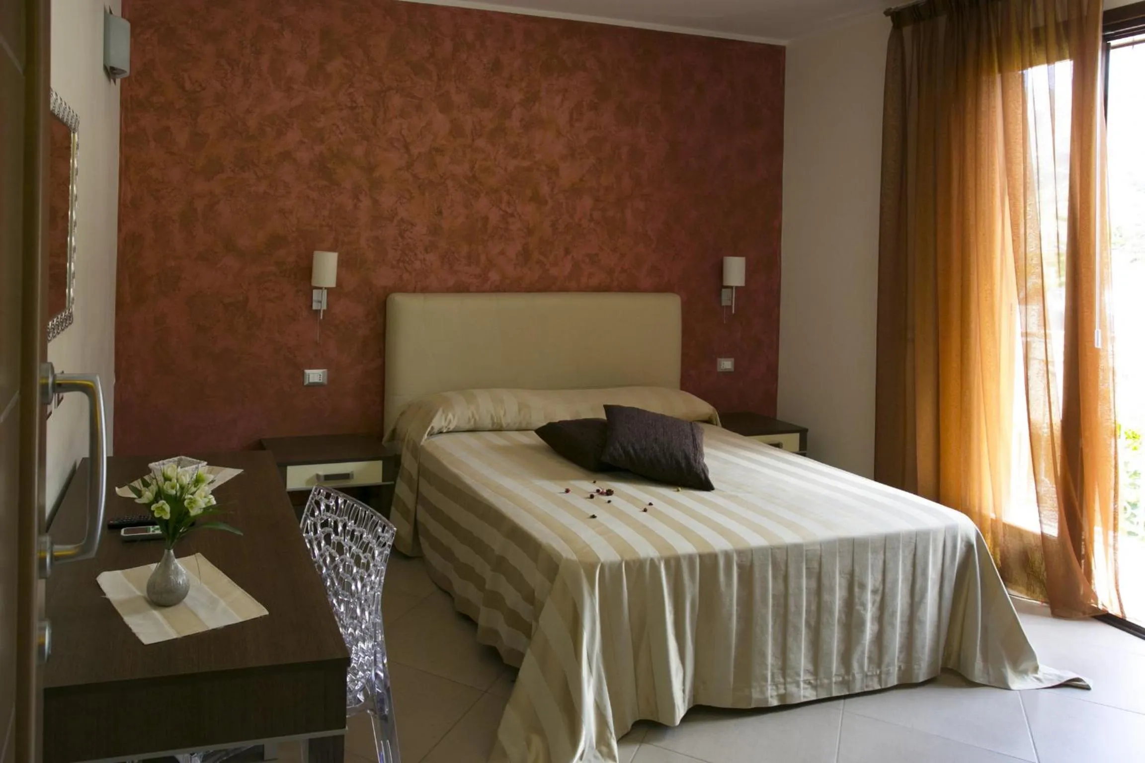 Bed in Trigrana Vacanze Hotel