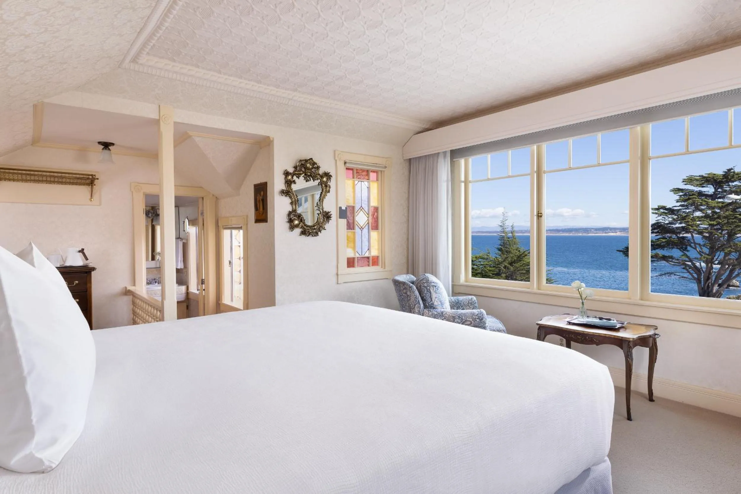 Seating area, Bed in Seven Gables Inn on Monterey Bay, A Kirkwood Collection Hotel
