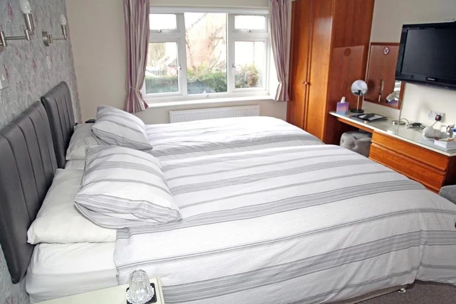 Bed in The Hinton Guest House