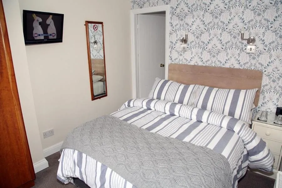 Bed in The Hinton Guest House