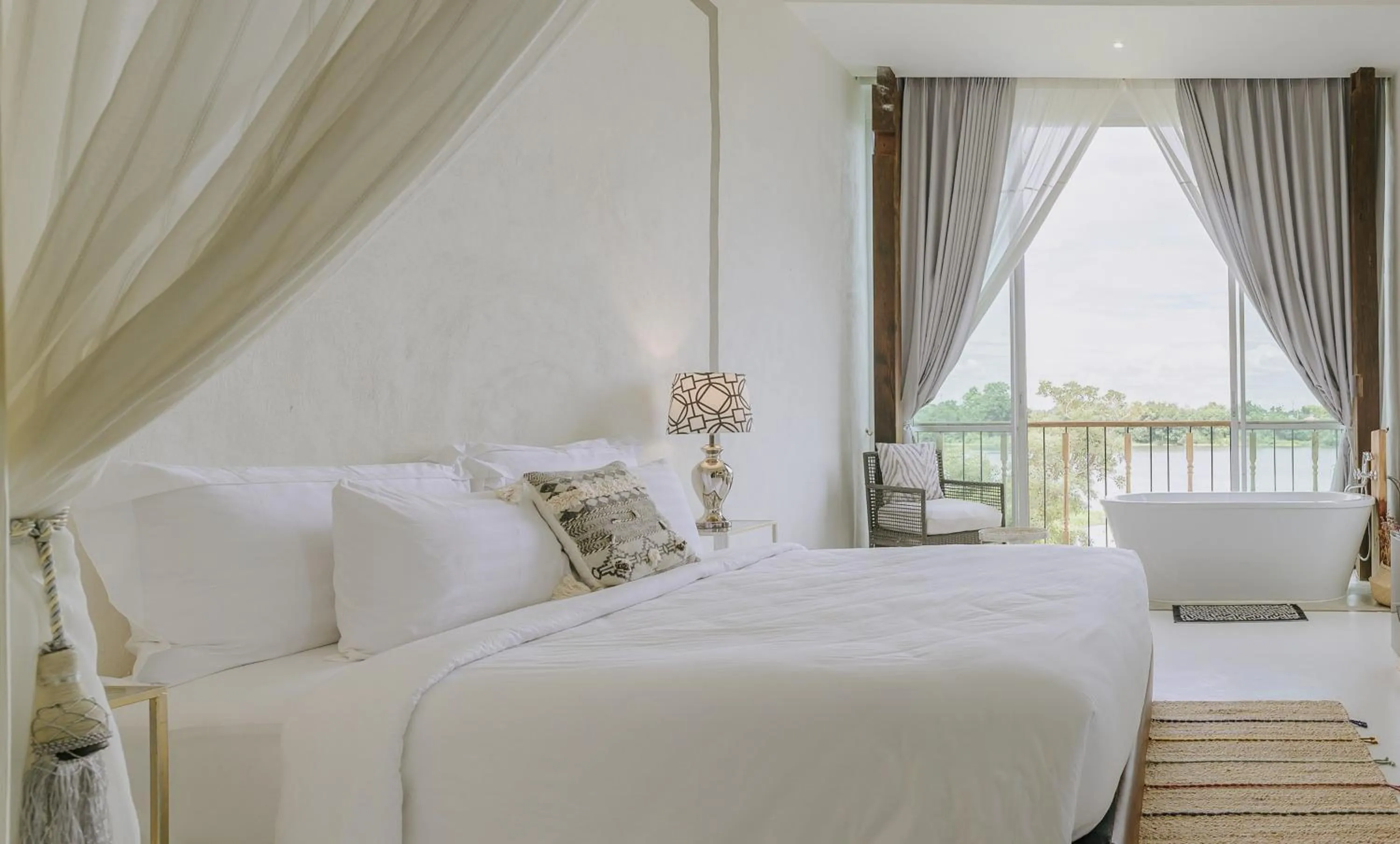 Bedroom, Bed in White Wall Riverfront Hotel