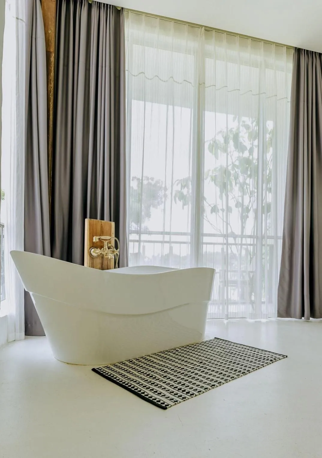 Bath in White Wall Riverfront Hotel