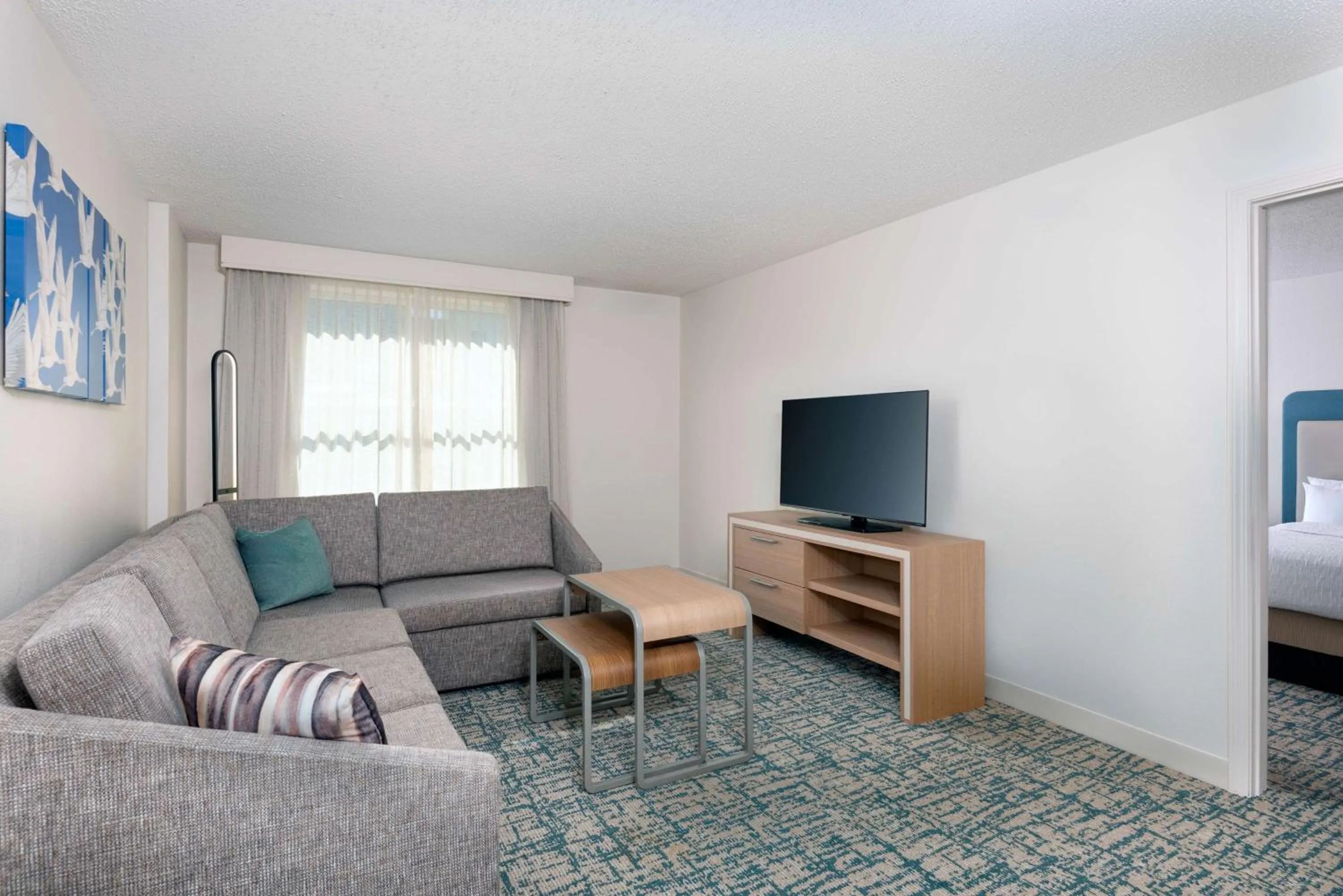 Living room, Bed in Homewood Suites by Hilton Tampa Airport - Westshore