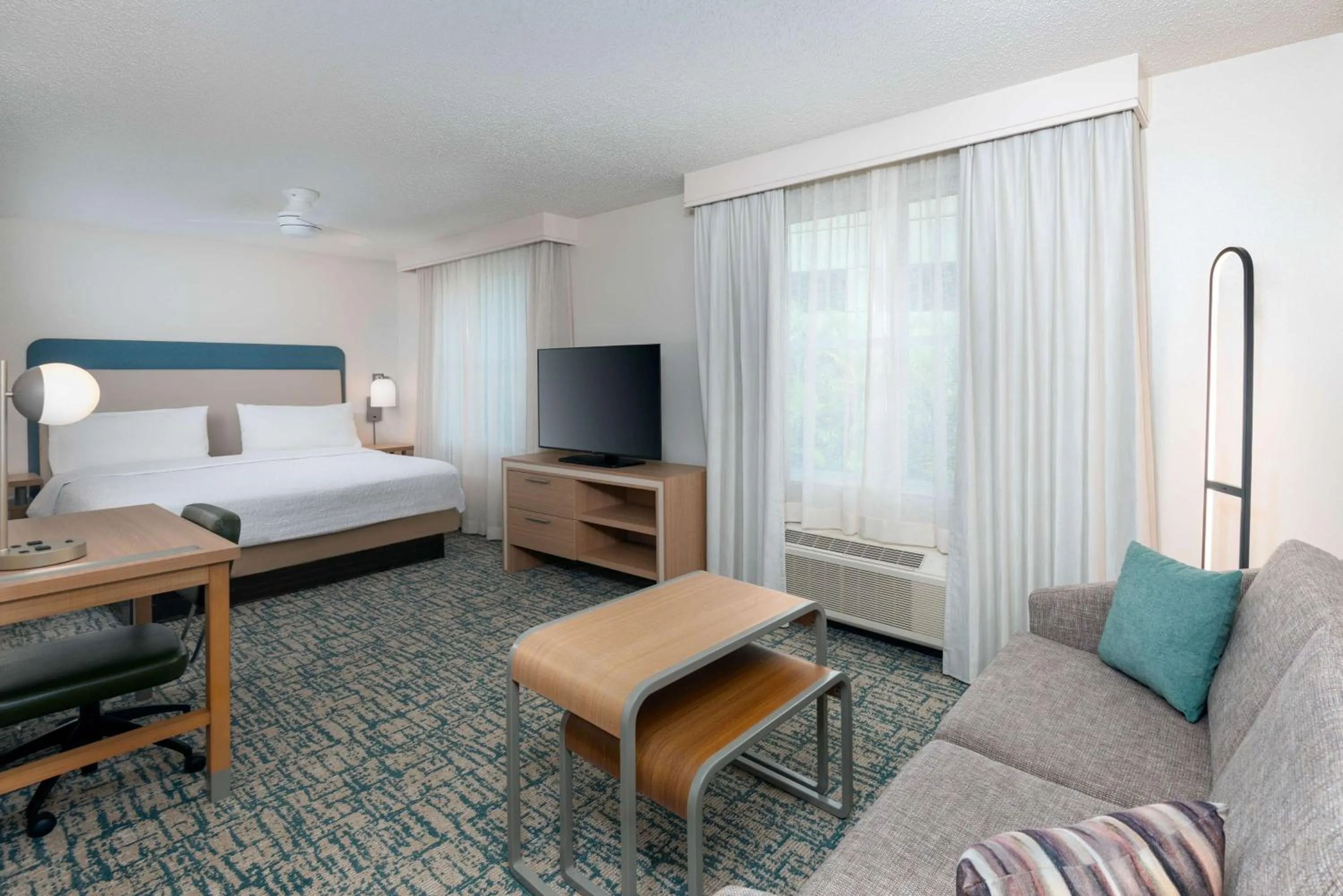 Living room, Bed in Homewood Suites by Hilton Tampa Airport - Westshore