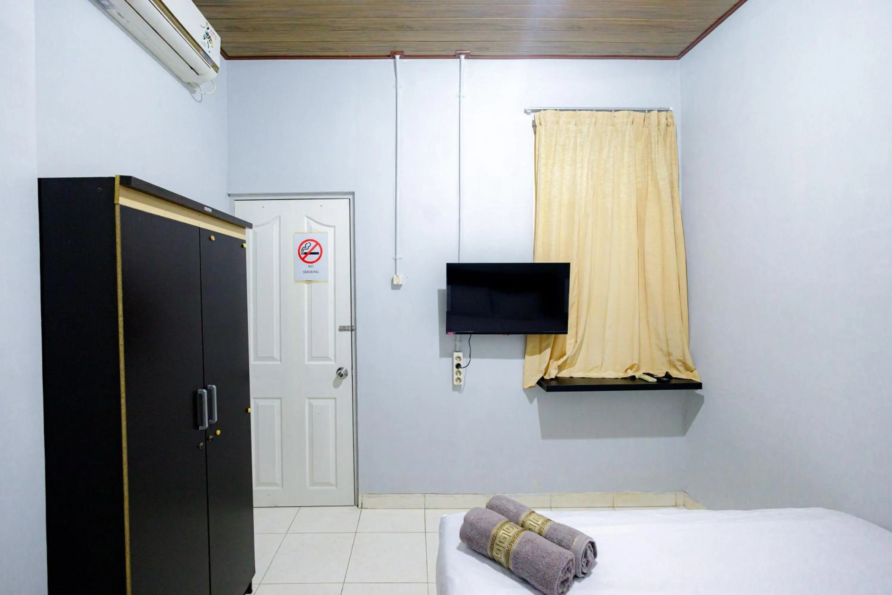 Bed in Marcello Residence Siwalankerto near Petra University Surabaya Mitra RedDoorz