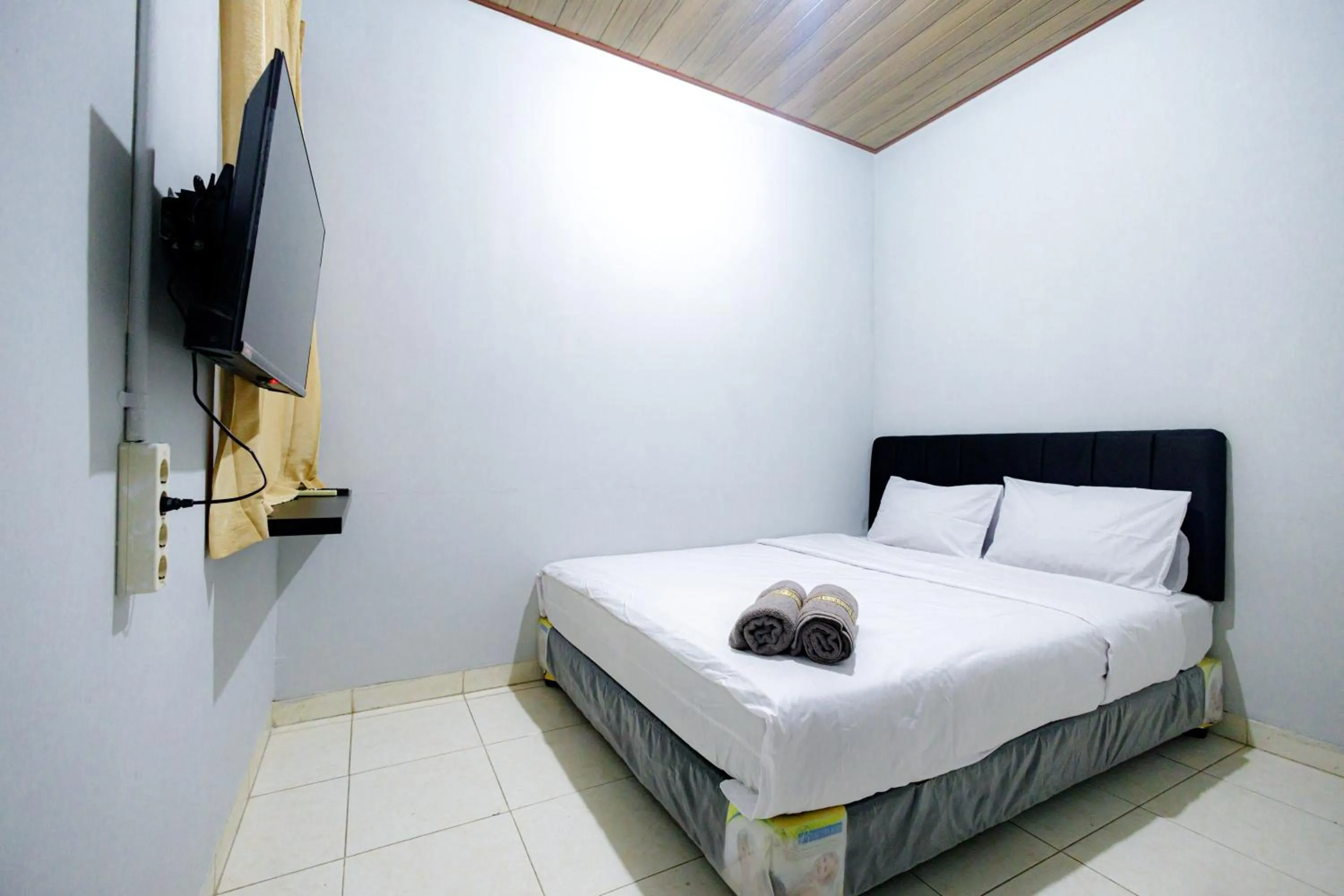 Bed in Marcello Residence Siwalankerto near Petra University Surabaya Mitra RedDoorz