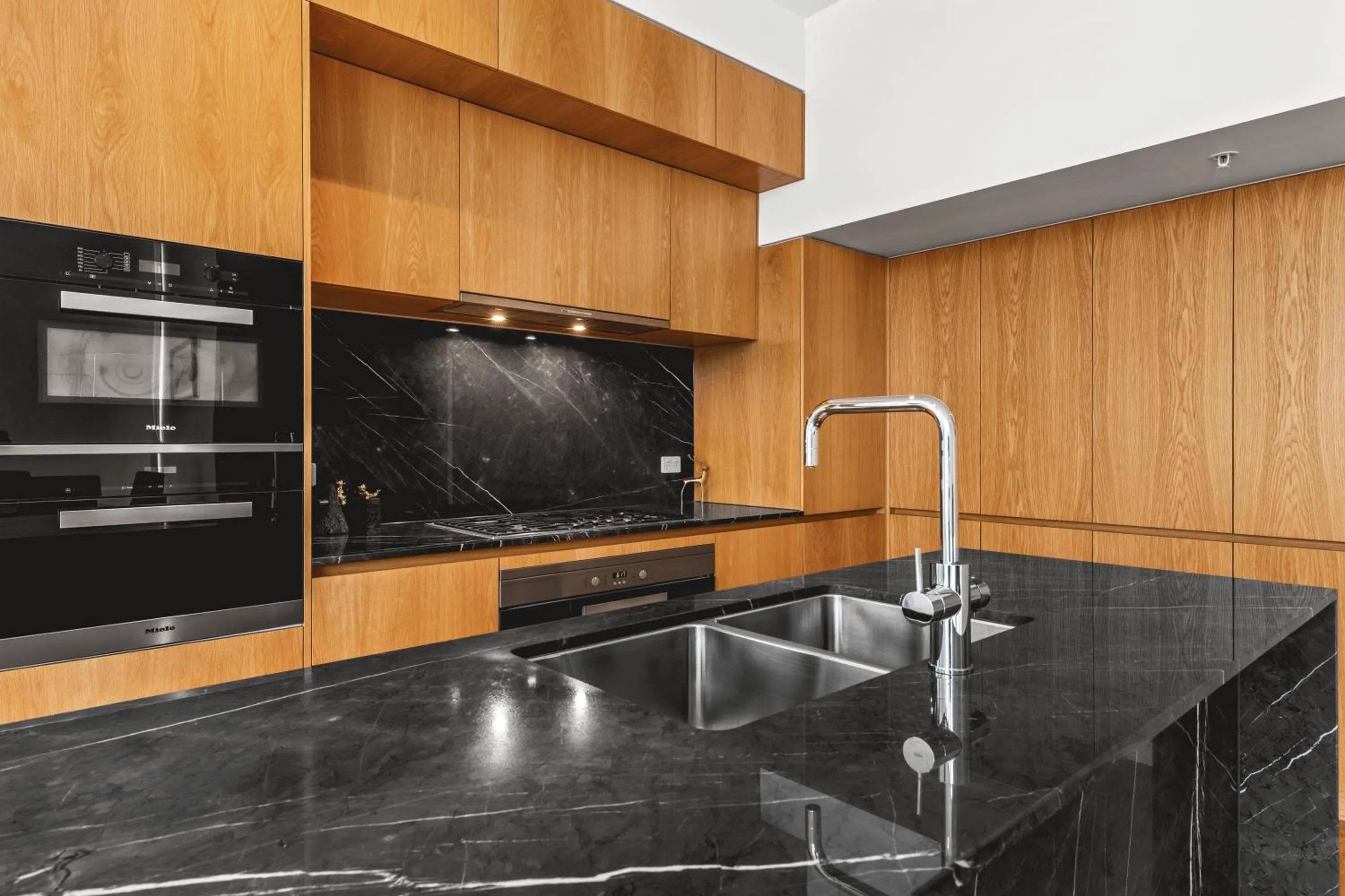 Kitchen or kitchenette in Brisbane One Apartments by CLLIX