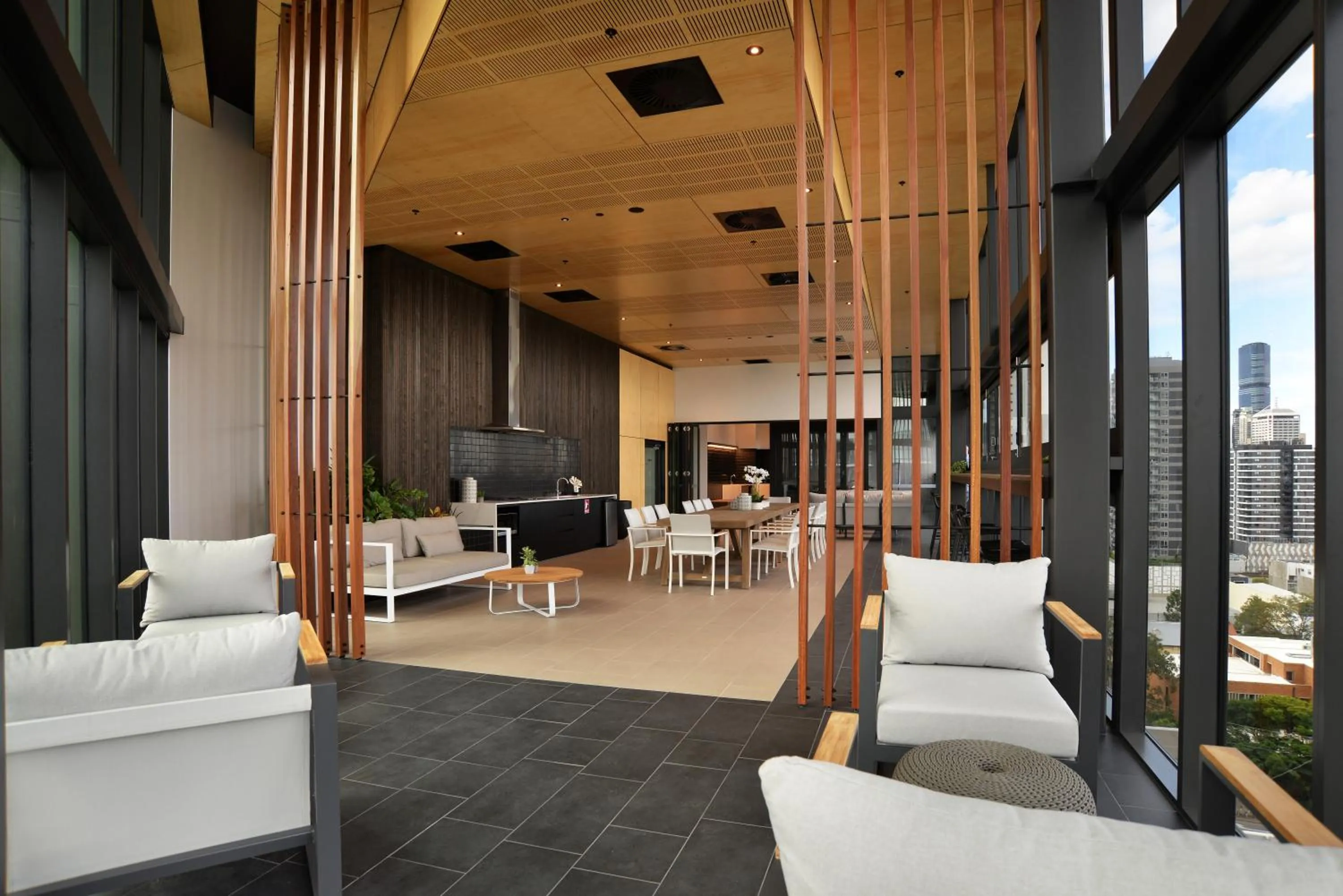 Communal lounge/ TV room in Brisbane One Apartments by CLLIX