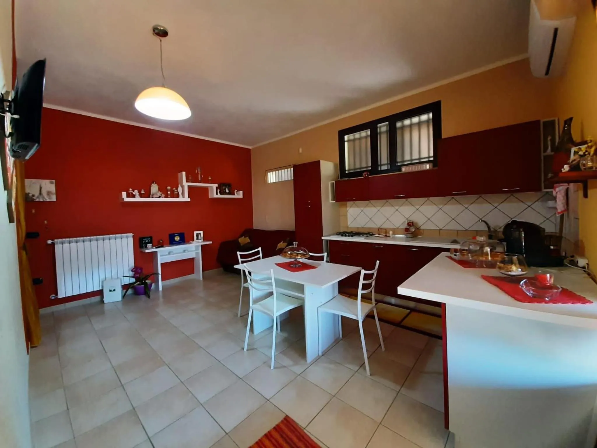 Communal kitchen in B&b Villa Santa Sofia by holidayngo