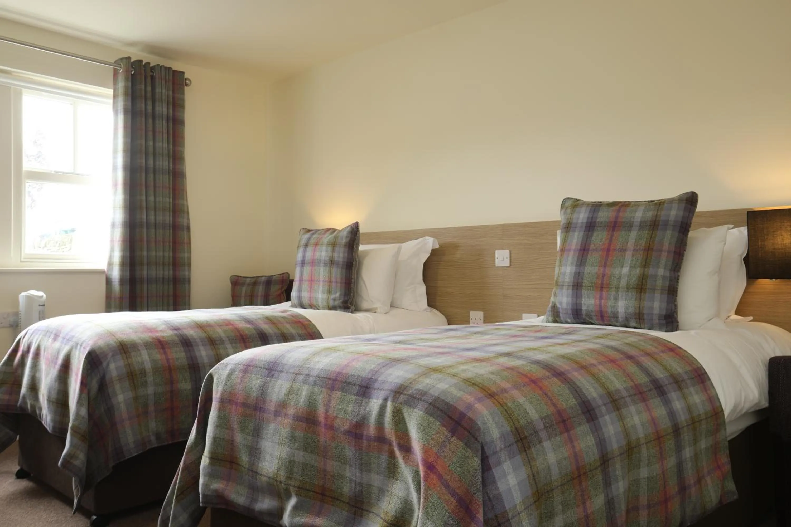 Bed in The Craven Heifer Inn