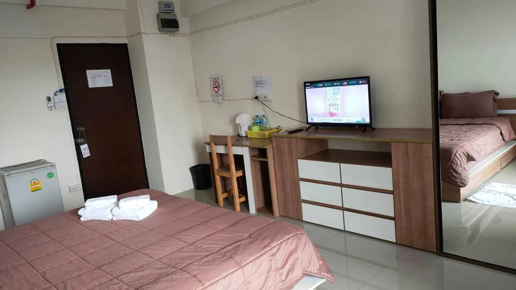 Bed in Komol Residence Bangkok