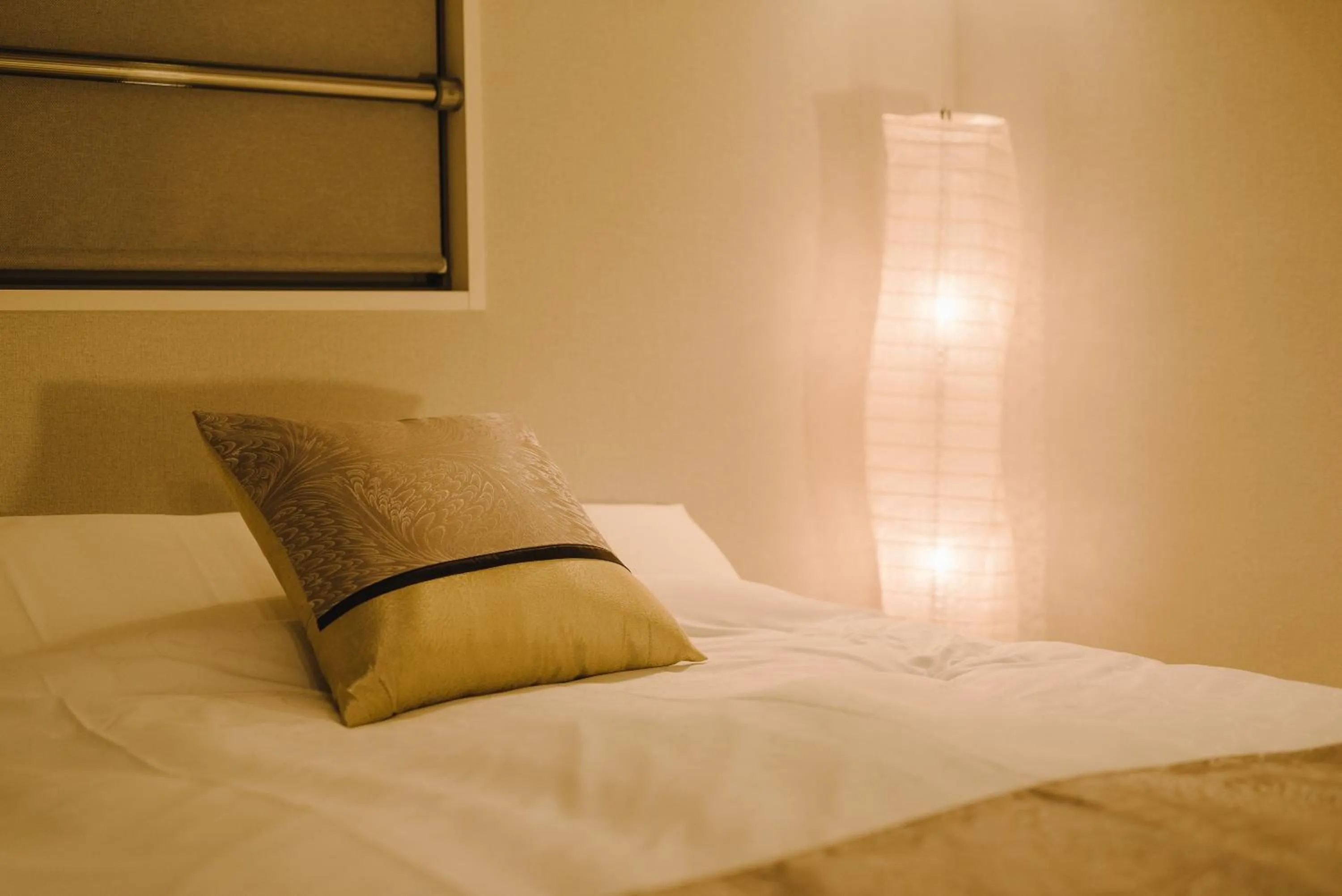 Bed in GRAND BASE Karatsu Ekiminami