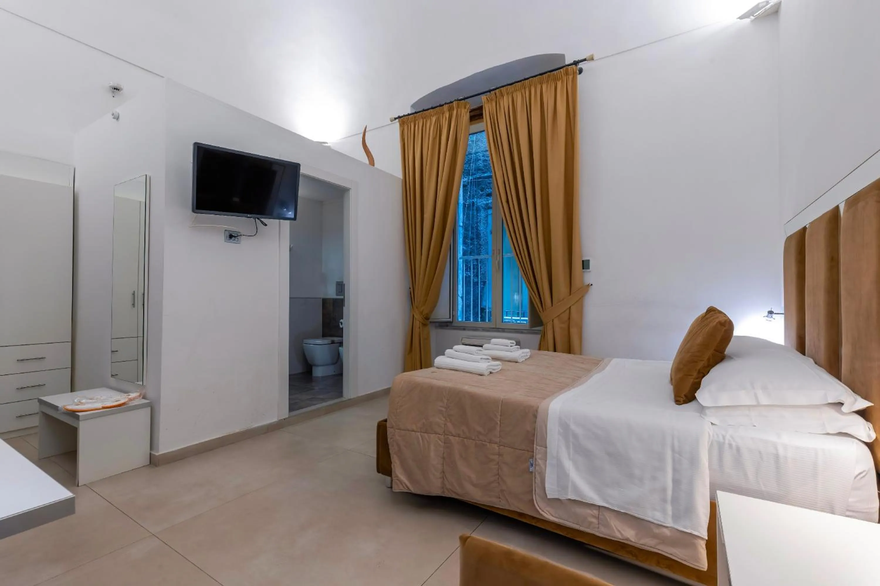 Bed in Il Tesoro Smart Suite & SPA