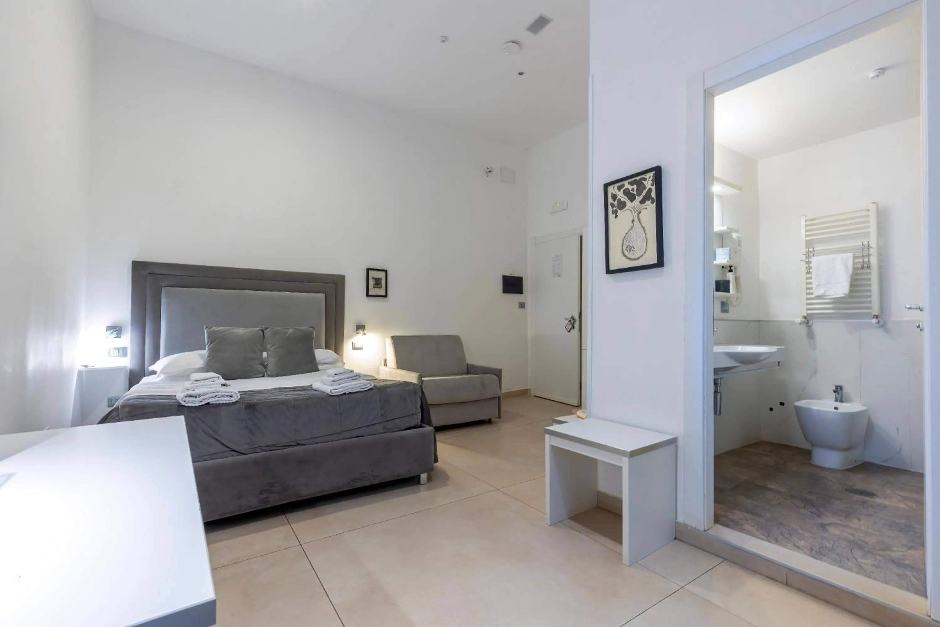 Bed in Il Tesoro Smart Suite & SPA