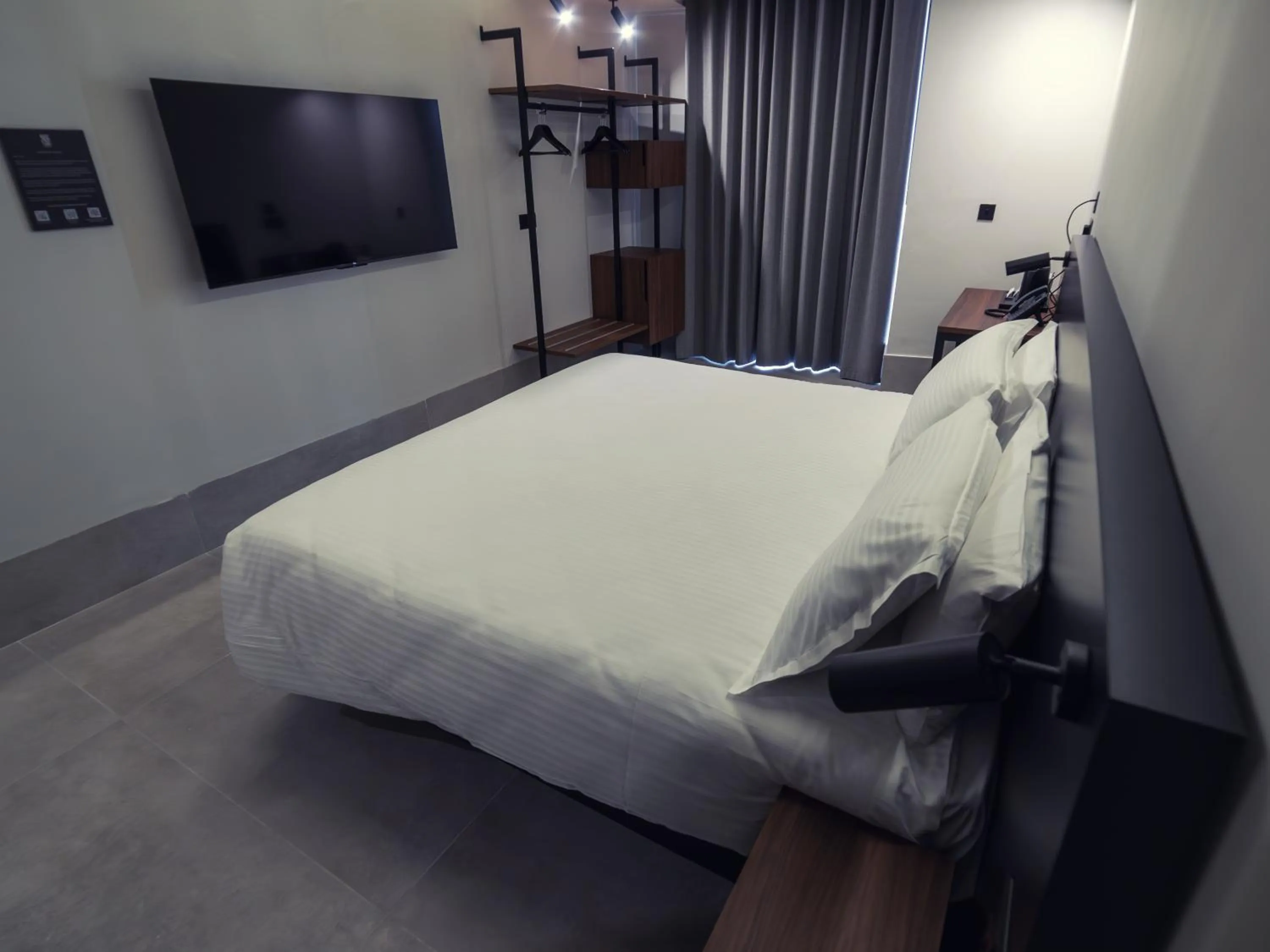 Bed in Onyx Suites & Apartments