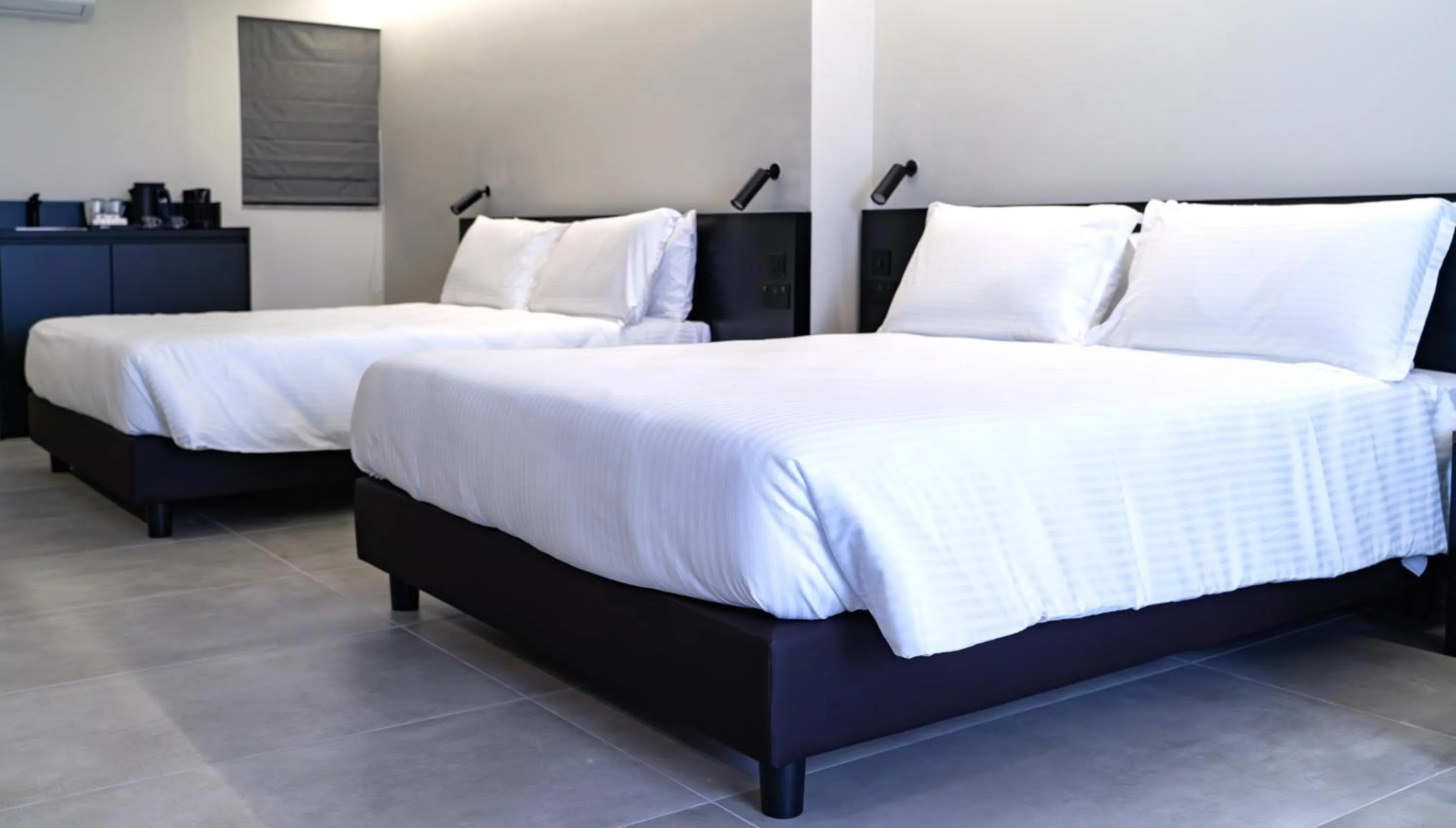 Bed in Onyx Suites & Apartments