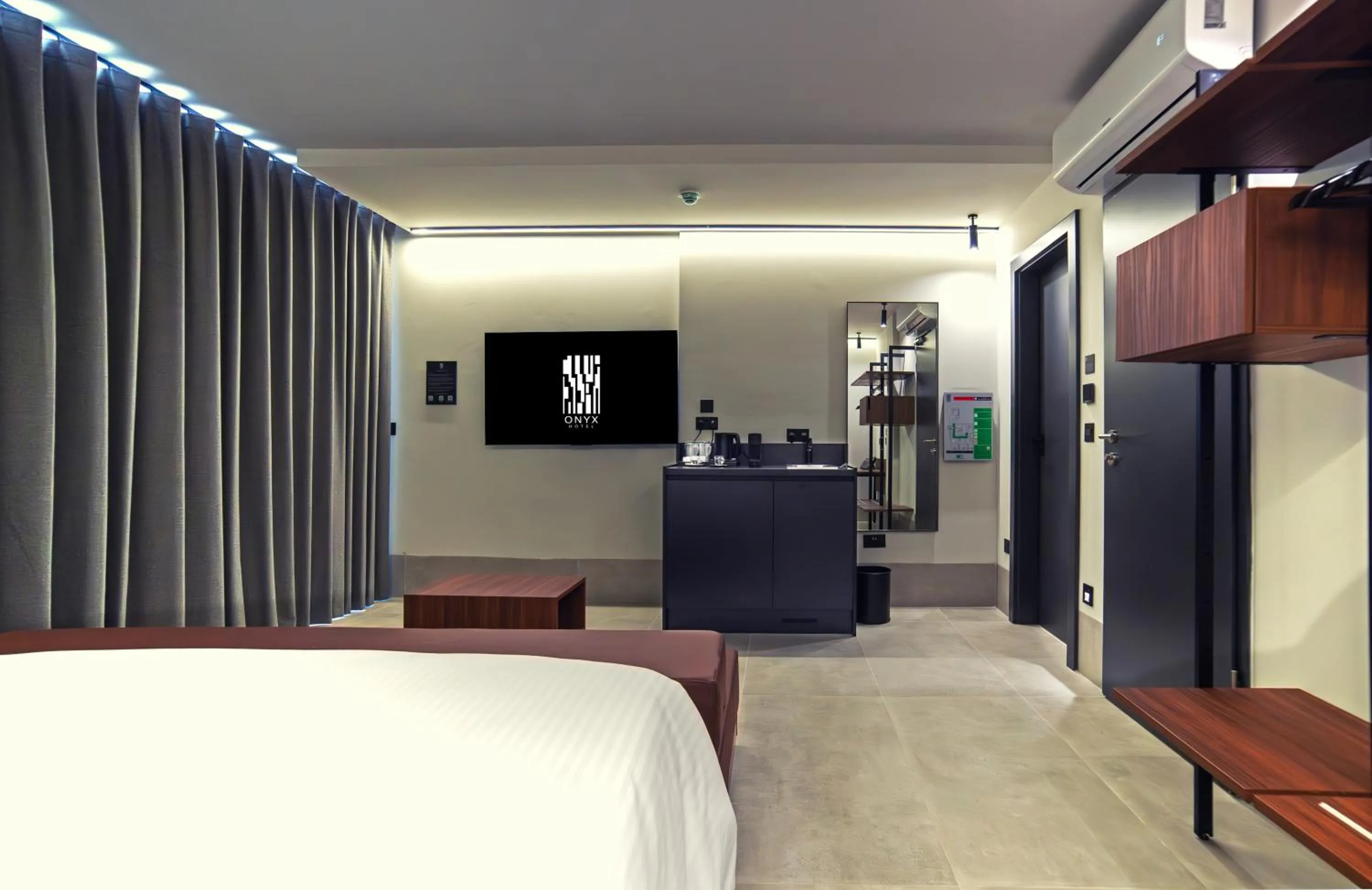 Bed in Onyx Suites & Apartments