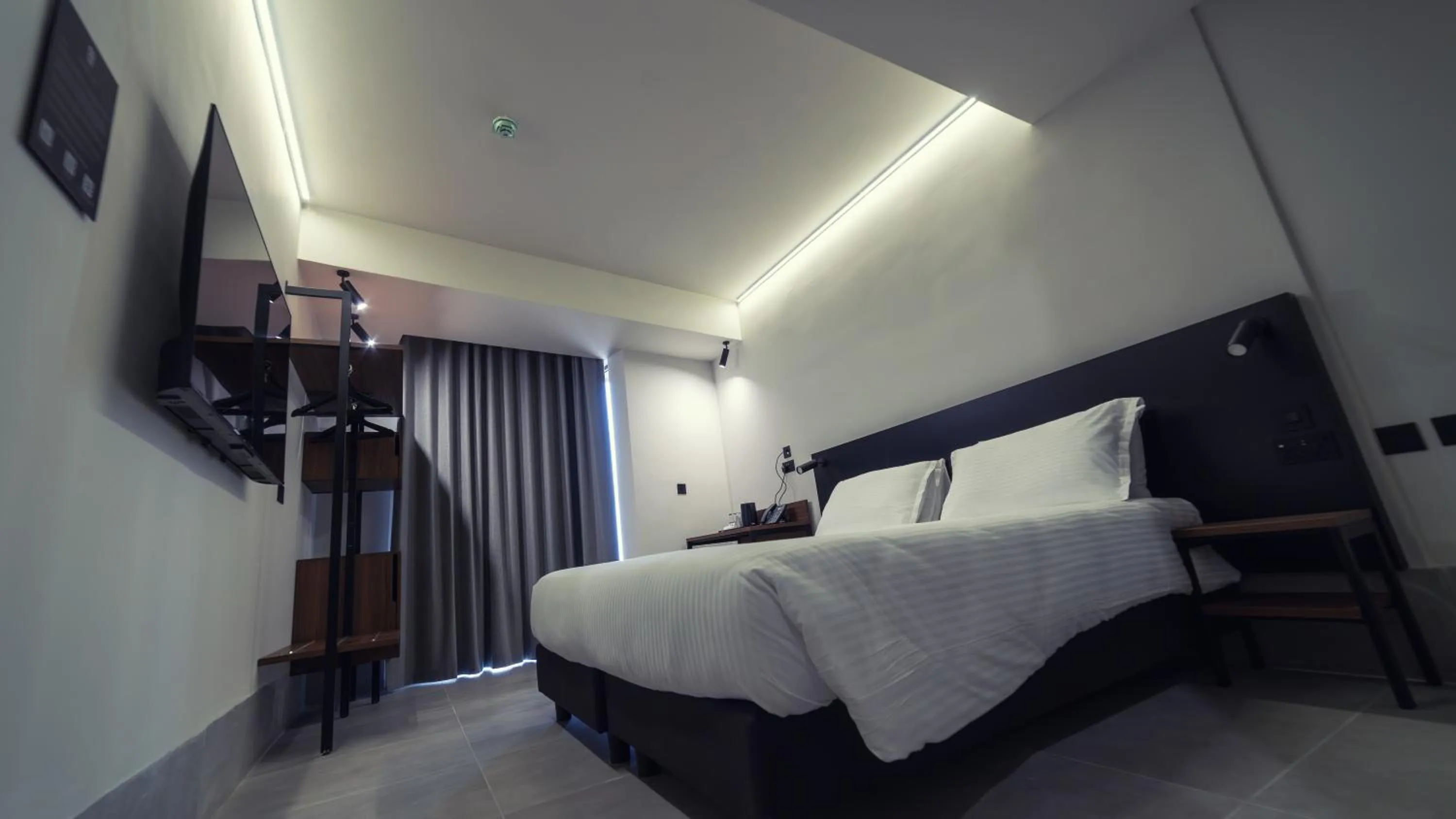 Bed in Onyx Suites & Apartments