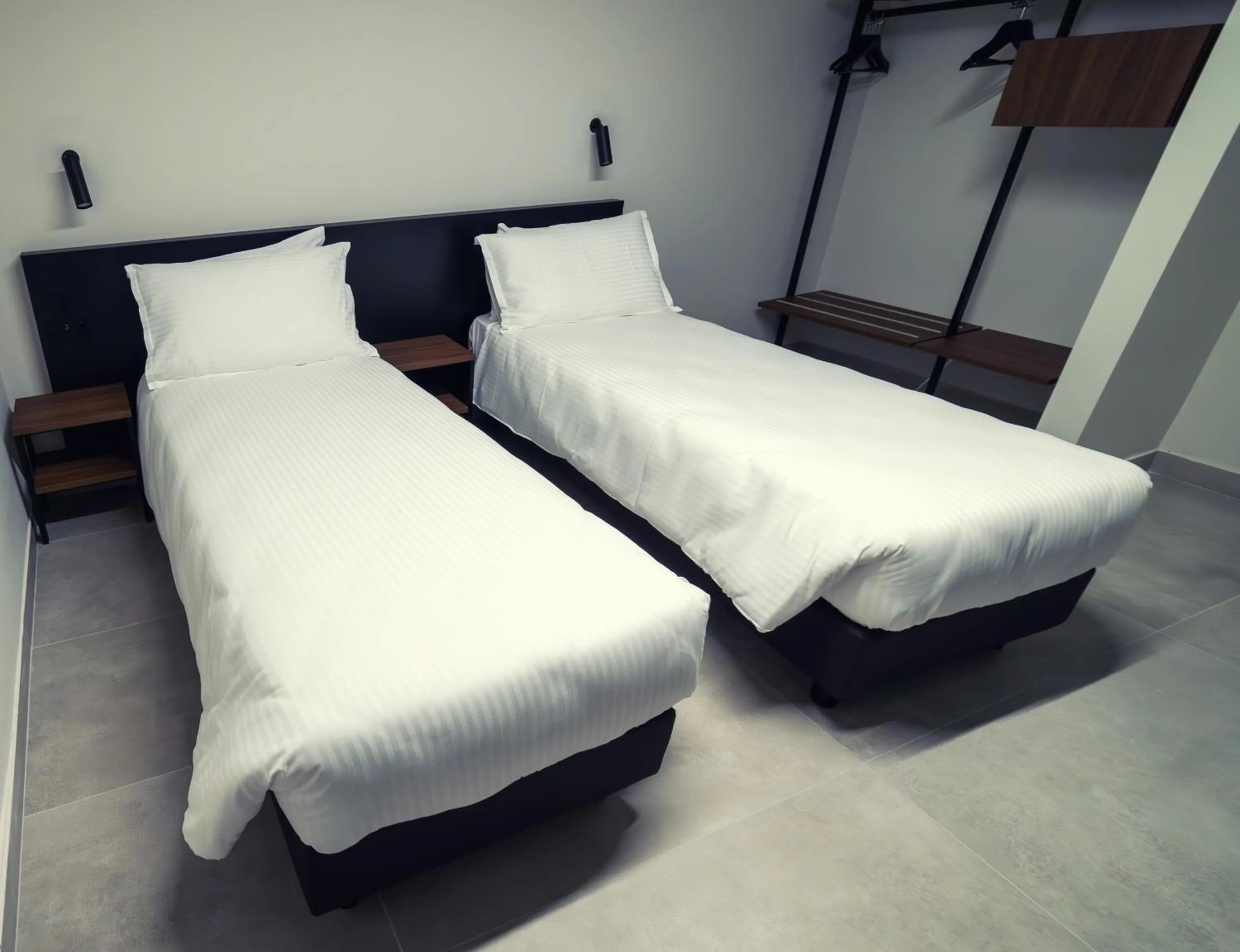 Bed in Onyx Suites & Apartments