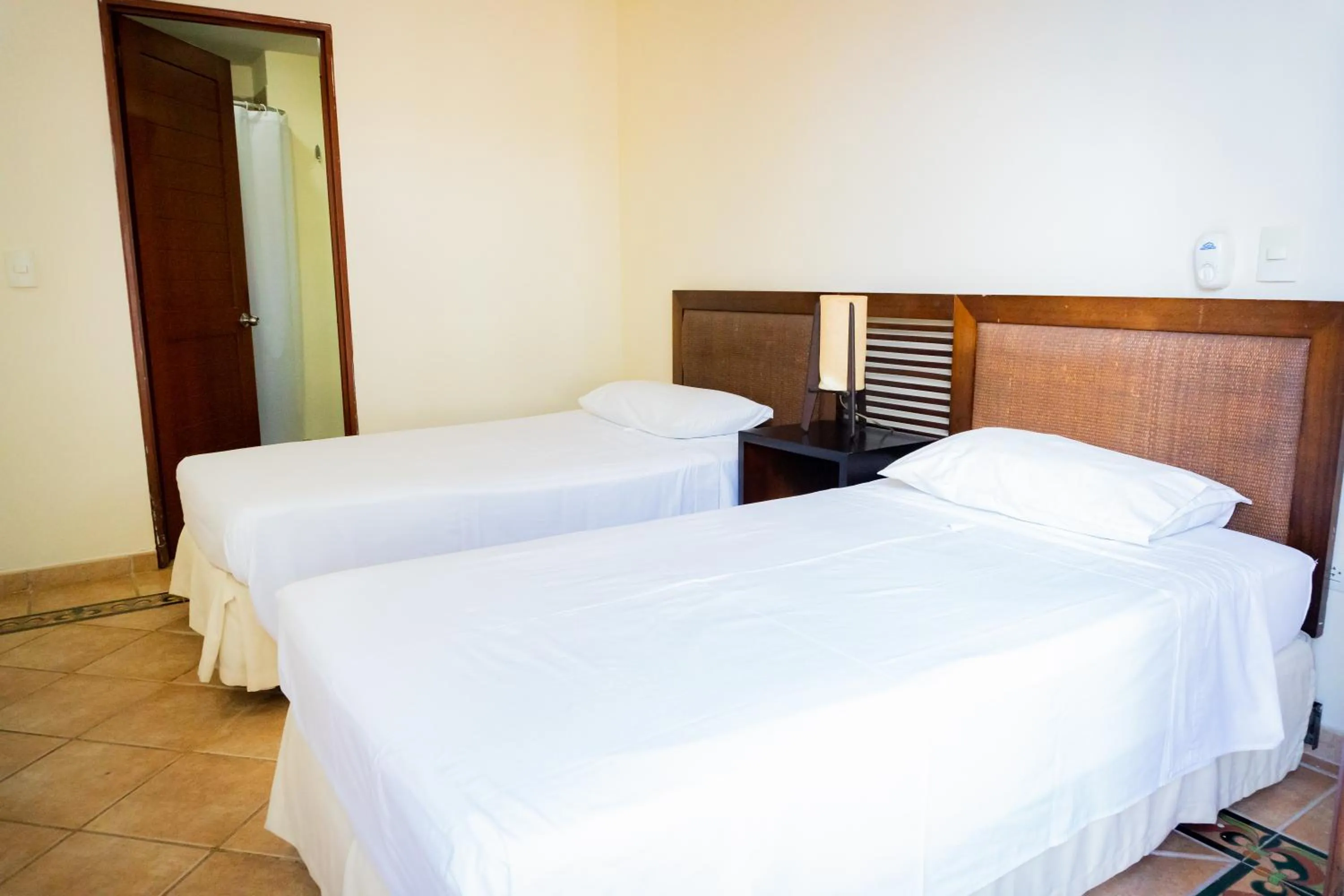 Bed in Hotel Peñon Suites