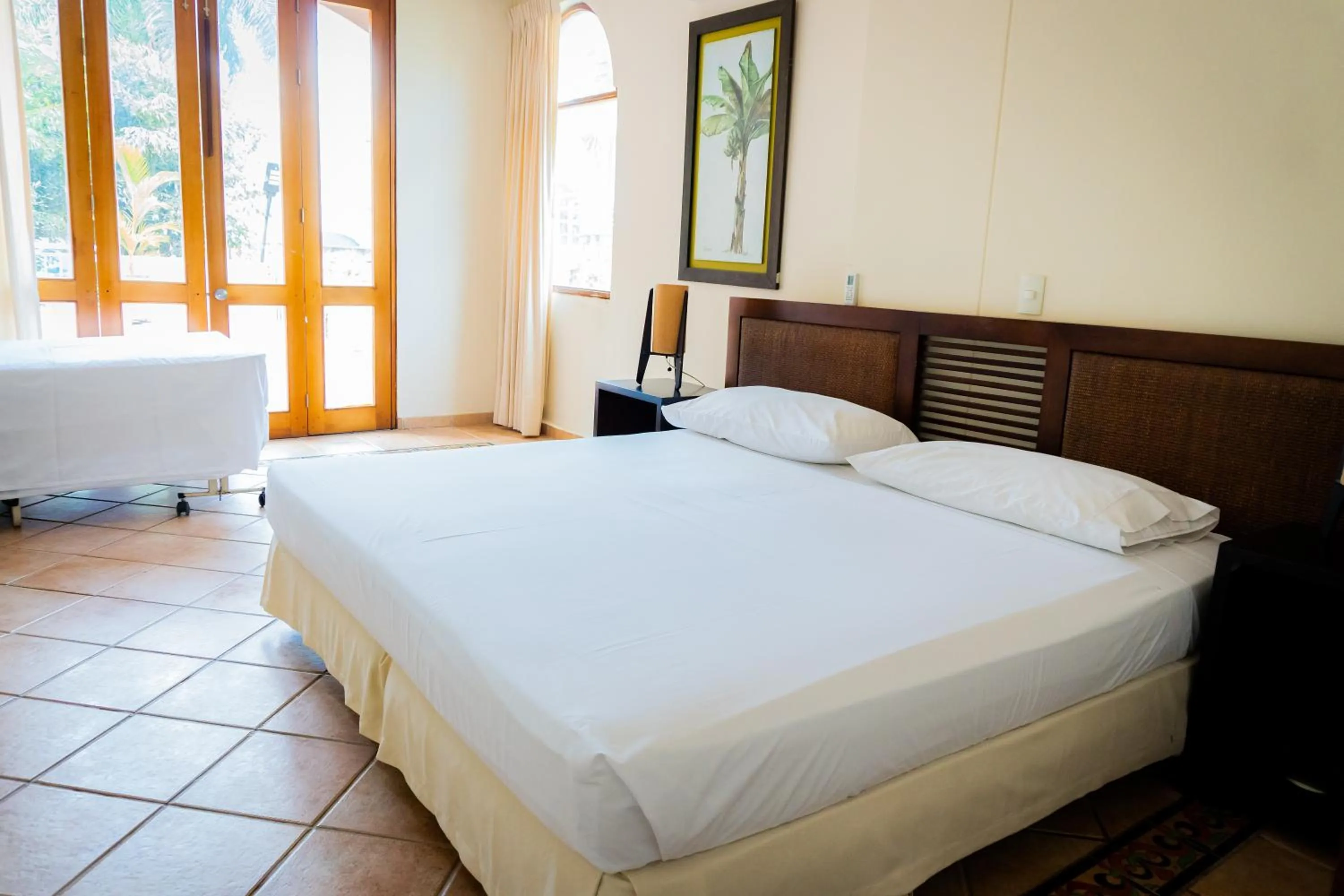 Bed in Hotel Peñon Suites