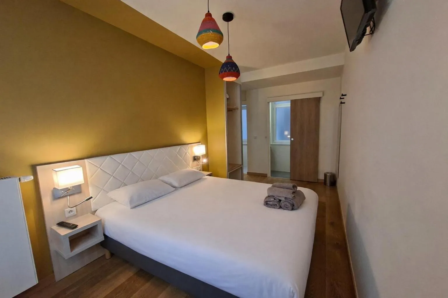 Bed in HOTEL AMBASSADEUR