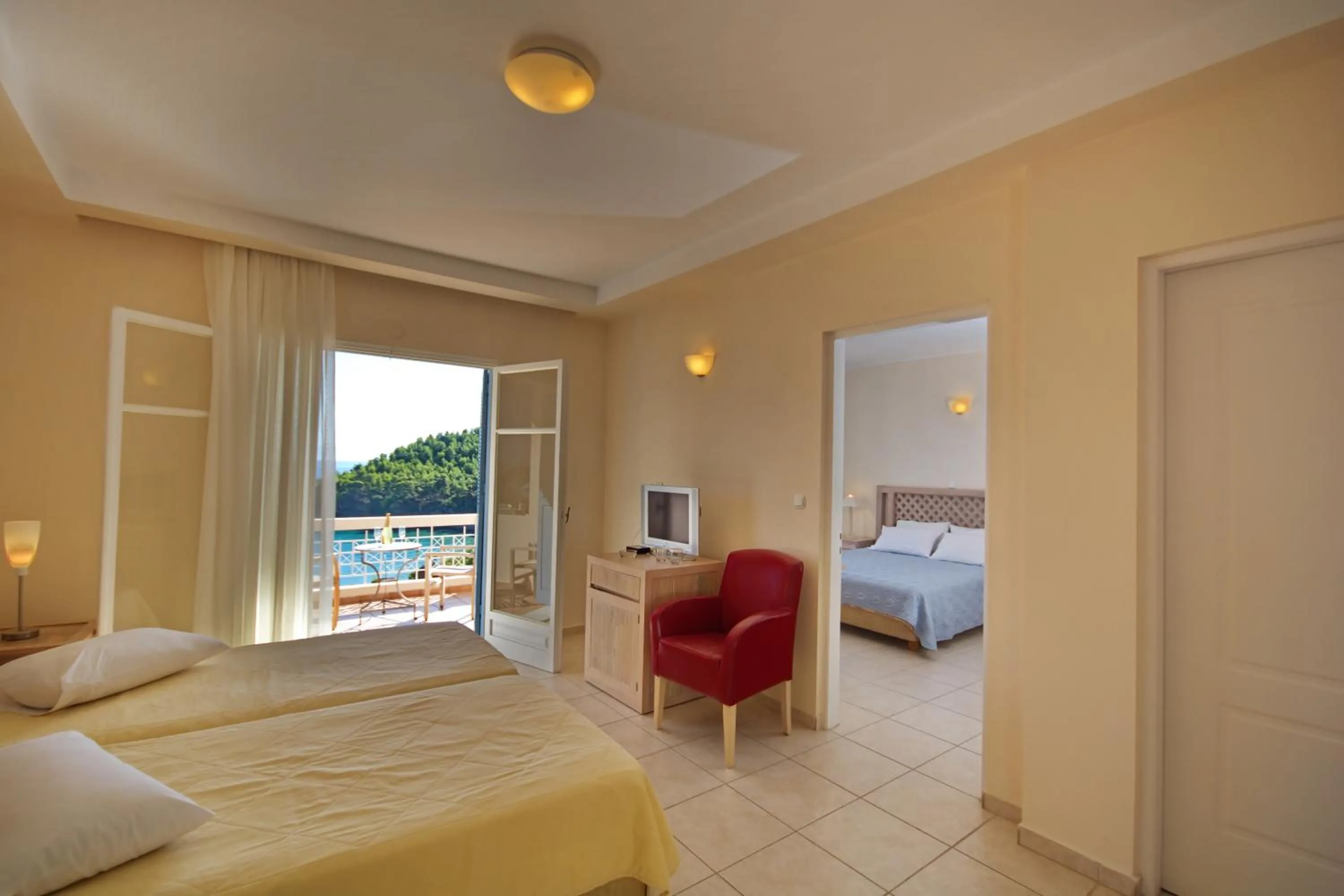 Bedroom, Bed in Alonissos Beach Bungalows And Suites Hotel