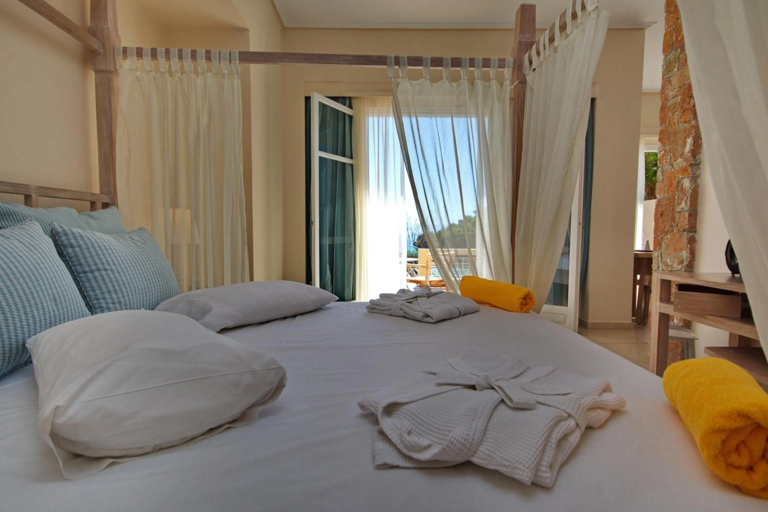 Bedroom, Bed in Alonissos Beach Bungalows And Suites Hotel