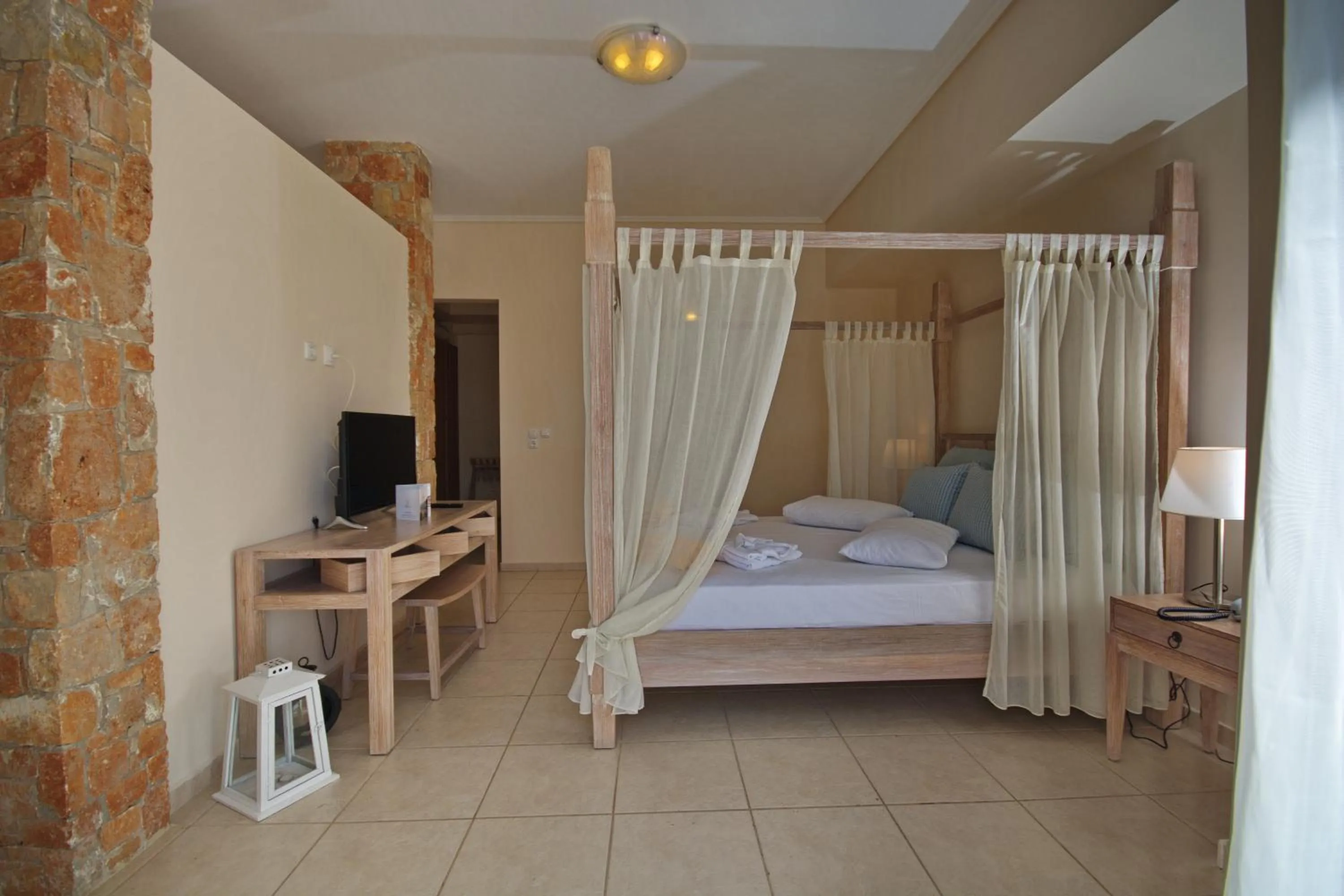 Bedroom, Bed in Alonissos Beach Bungalows And Suites Hotel