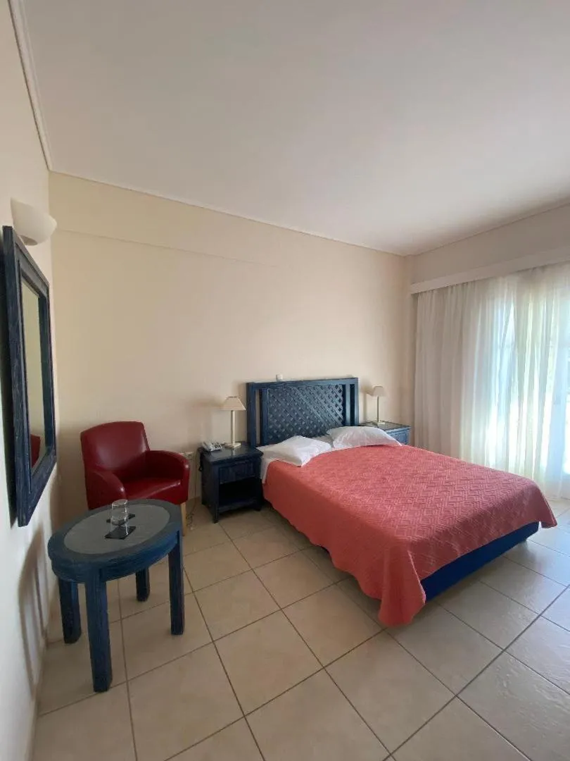 Bedroom, Bed in Alonissos Beach Bungalows And Suites Hotel