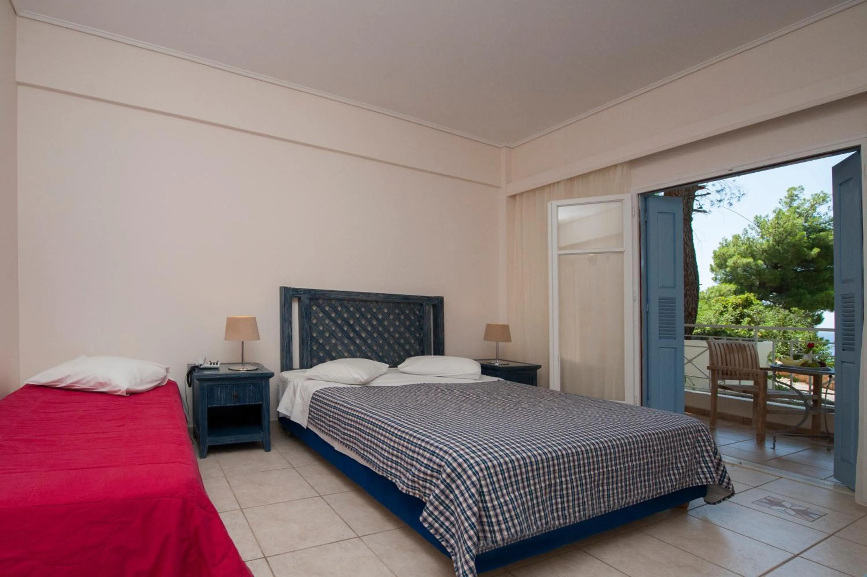 Bed in Alonissos Beach Bungalows And Suites Hotel