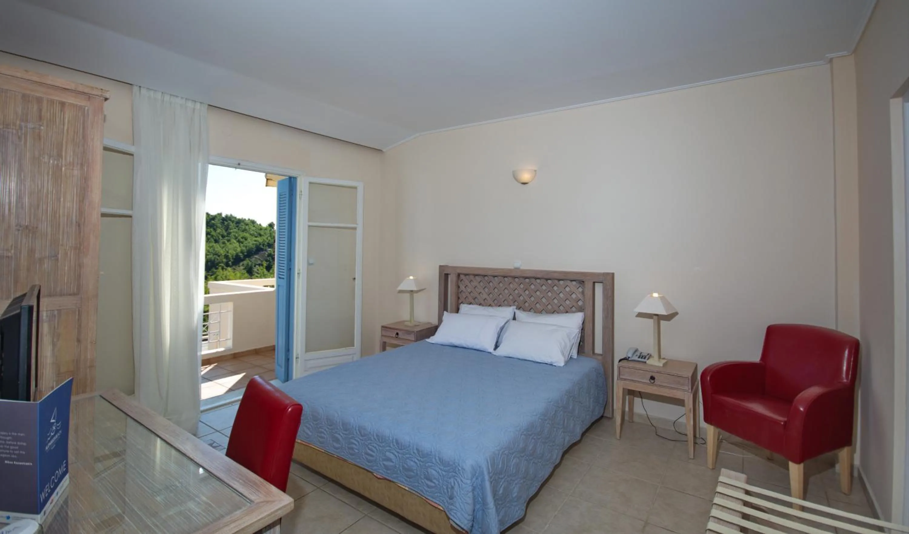 Bed in Alonissos Beach Bungalows And Suites Hotel