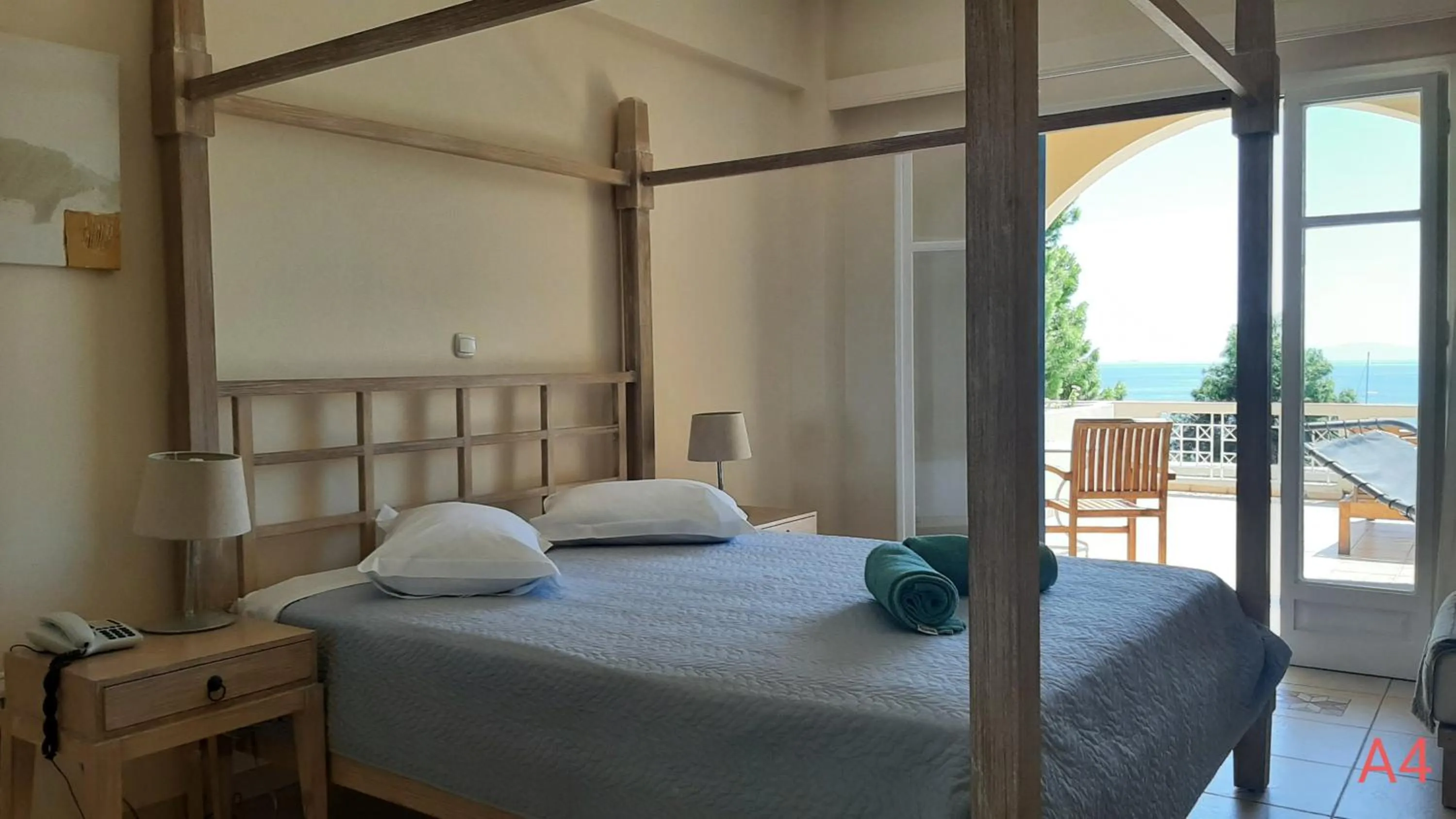 Bed in Alonissos Beach Bungalows And Suites Hotel