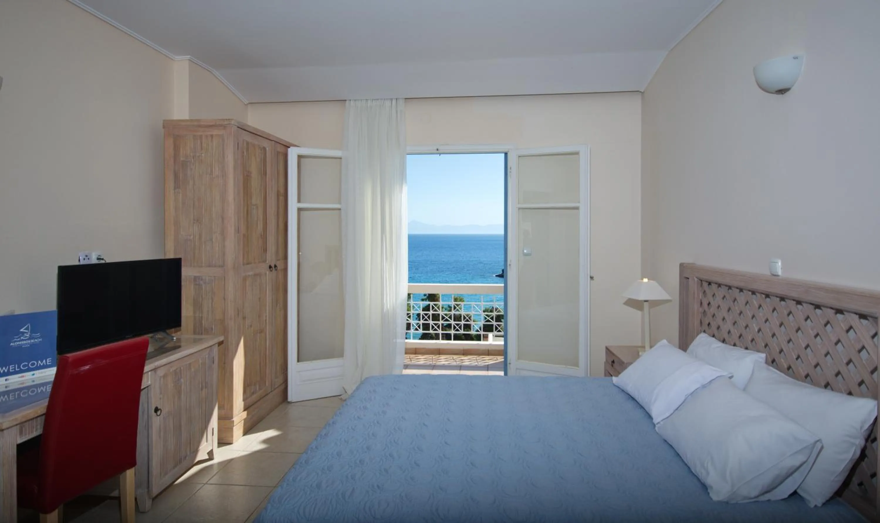 Bedroom, Bed in Alonissos Beach Bungalows And Suites Hotel