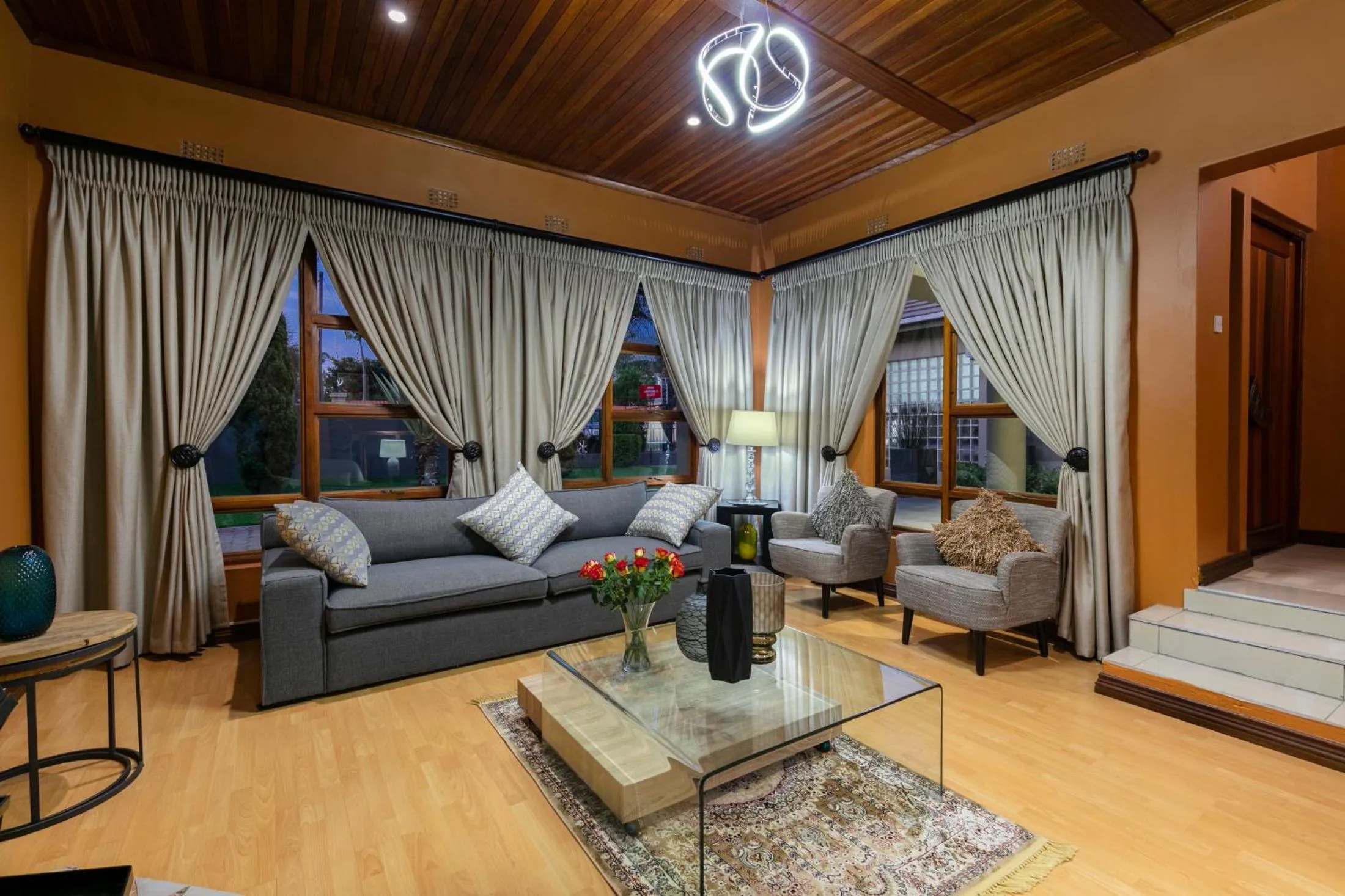 Communal lounge/ TV room in Orchid Luxury Boutique Guesthouse