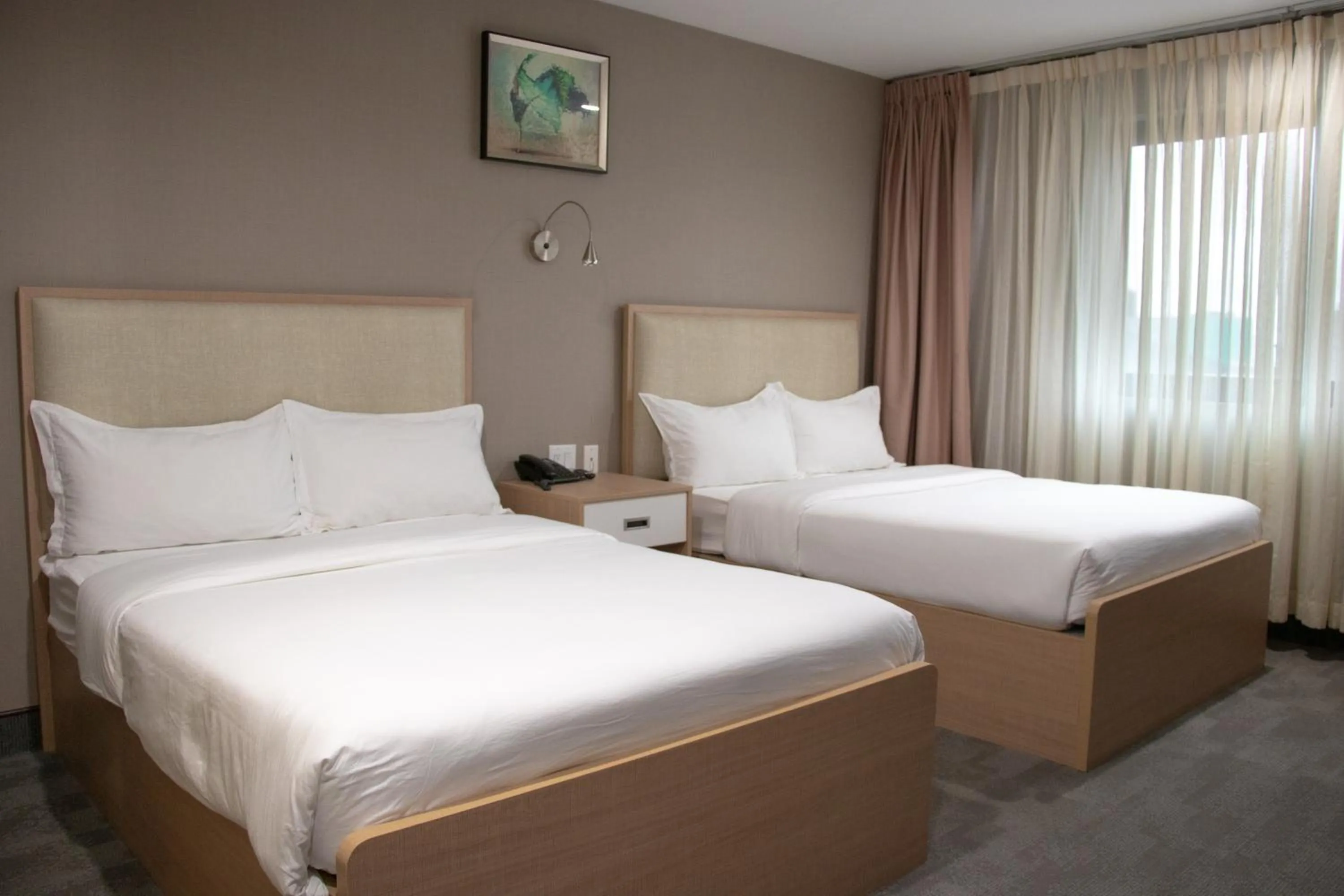 Bed in LIC Plaza Hotel