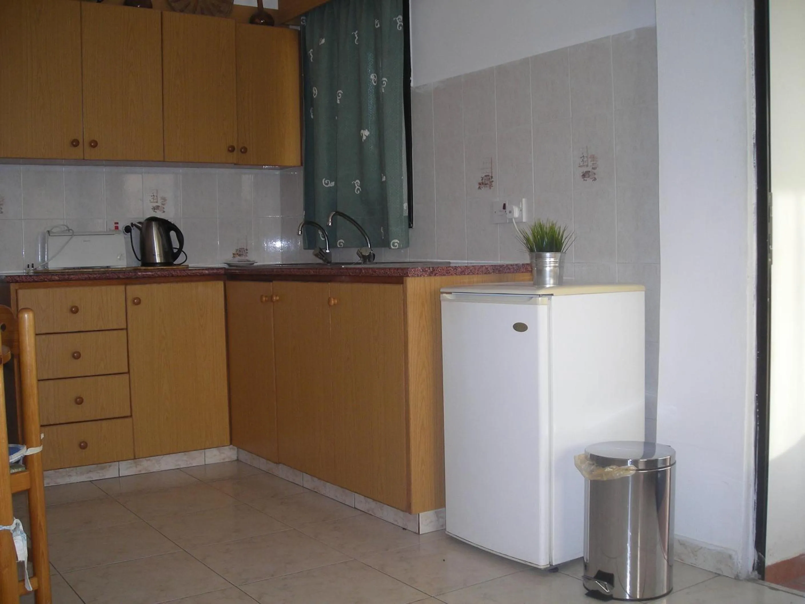 Kitchen or kitchenette in Angela Holiday Apartments