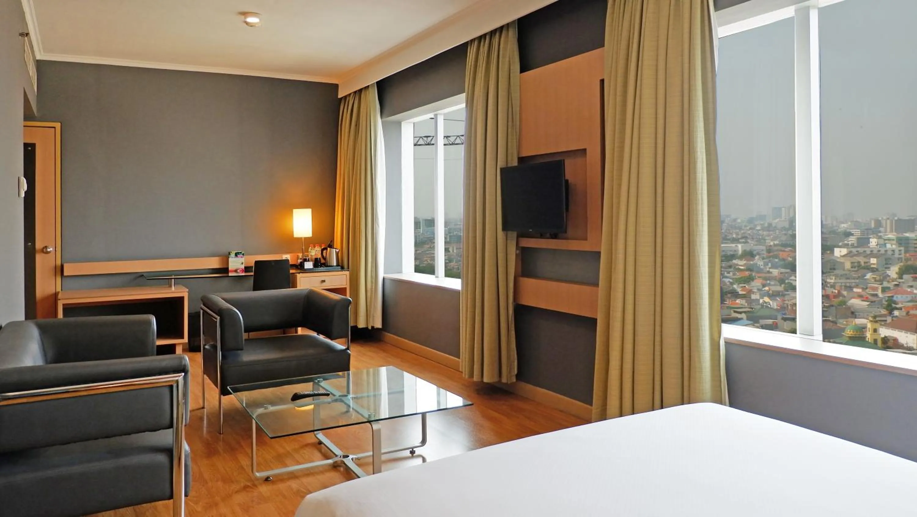 Living room, Bed in Hotel KIMAYA Slipi Jakarta By HARRIS